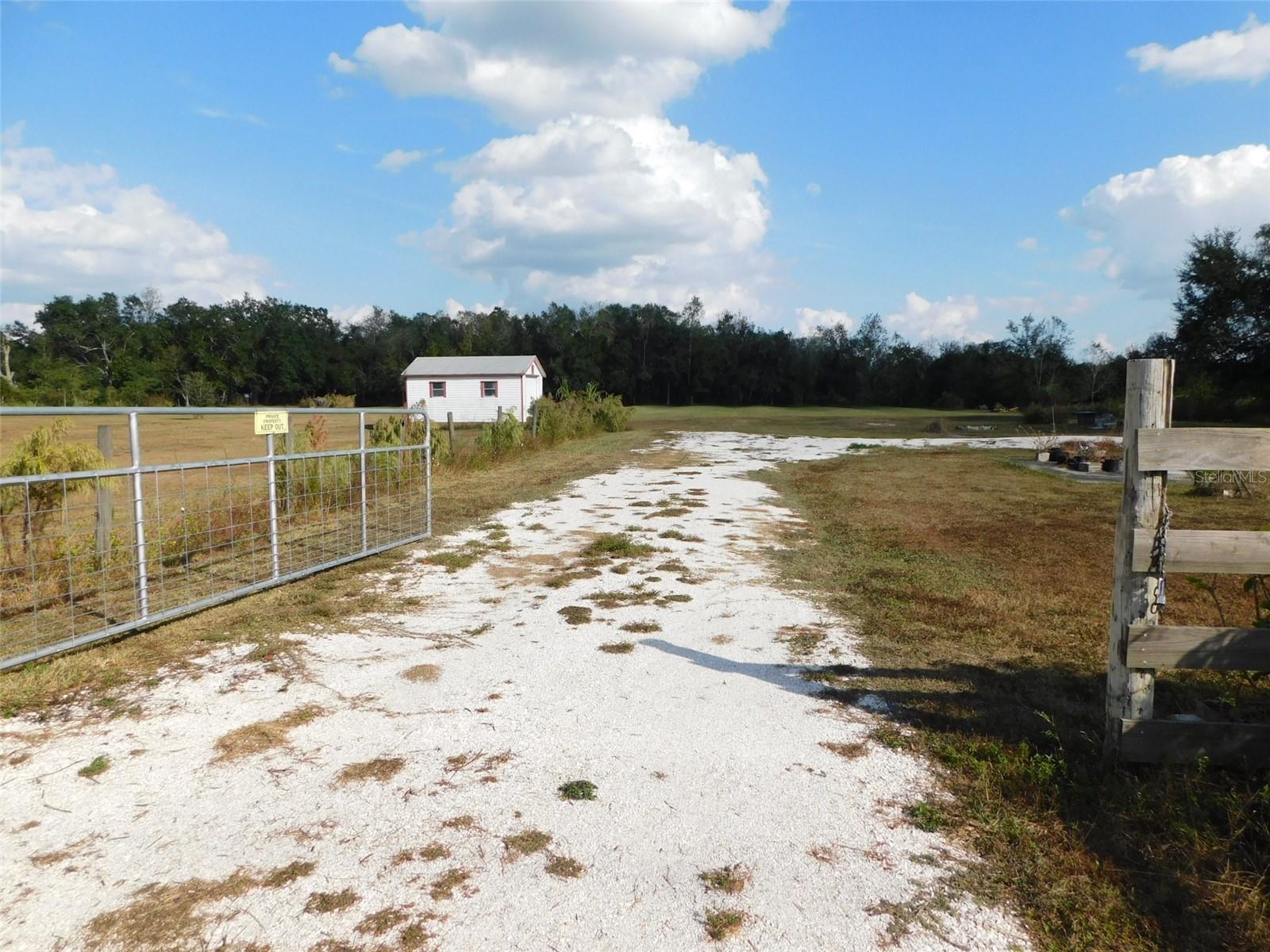 FENCED 5.05 ACRES FOR SALE, WEST OF ARCADIA, OFF STATE ROAD 70.  CLEARED, PASTURE, GRASS LAND, PUMP HOUSE WITH WORKSHOP AREA, WELL,  HAS ELECTRIC, SEPTIC TANKS, 12X28 STORAGE BUILDING. LAND IS CLEARED AND PREPARED FOR YOUR NEW HOME. ZONED FOR HORSES AND OTHER GRAZING ANIMALS. ZONING ALLOWS FOR MANUFACTURER HOMES. PROPERTY LINE HAS TREES, MAKING THIS A VERY PRIVATE PIECE OF LAND. WOODS ON THE EAST SIDE OF THE PROPERTY. THERE IS A 50 AMP RV PLUG SERVICE. SEVERAL CONCRETE SLABS ON THE PROPERTY FROM WHERE THERE WERE MANUFACTURER HOMES OR HOUSE PREVIOUSLY ON THE PROPERTY, COULD HAVE BEEN SLABS FOR PORCHES OR PARKING AREAS.