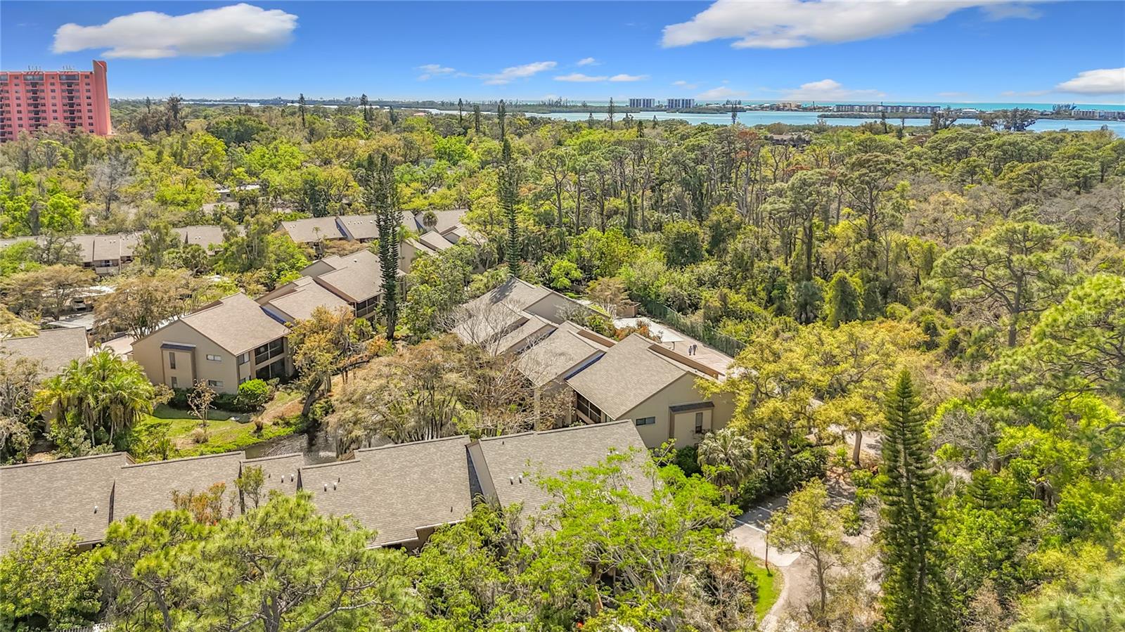 Welcome to Pelican Cove, a gated waterfront community on 75 acres along Little Sarasota Bay. This second-floor end-unit condominium has its own private entrance and is one of the larger floor plans available. The home features an updated kitchen with an open terrace, an open floor plan with cathedral ceilings, southwest exposure that fills the space with natural sunlight, and two updated bathrooms with walk-in showers.  The community offers an 86-slip marina with sailboat access and no fixed bridges to the Gulf, six heated pools and a hot tub, three clubhouses, lighted tennis and pickleball courts, basketball courts, dog-walking areas, and over five miles of walking trails and boardwalks. Creative amenities include art studios, a pottery and sculpture room, and a woodworking shop, plus classes through Pelican Cove University and frequent concerts and cultural events.  

Centrally located in South Sarasota (west of the trail), Pelican Cove is a short drive to downtown Sarasota, nearby beaches, and convenient shopping including Sprouts and Costco, with Trader Joe’s and Whole Foods coming soon. Schedule a showing to experience this sun-filled, well-appointed end unit and the exceptional lifestyle the community offers.