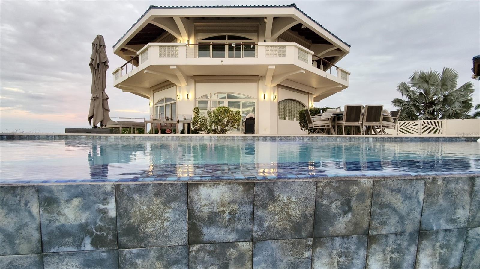 Brisas de Jazmín: Where moonlight and jasmine meet the Caribbean horizon
Brisas de Jazmín – Vieques Iconic Island Estate

An extraordinary sanctuary for the island seekers.

Welcome to Brisas de Jazmín, a breathtaking estate perched atop 5+ acres of pristine island terrain. This architectural masterpiece offers a rare blend of artistry, resilience, and luxury. Designed for those who demand both sophistication and seclusion, the property is a statement of refined island living with 360-degree views of the Caribbean Sea and Vieques’ untouched beauty.

Estate Highlights

• Grand Living Spaces: Up to 4 bedrooms and 3 island-inspired baths, each crafted for comfort and connection.

· Home office with dramatic views

• Outdoor Paradise: Expansive lanai, brand-new pool, pool house, and curated outdoor living spaces designed for entertaining under the stars

• Artistry & Craftsmanship: Custom cabinetry hand crafted by Disney artists, soaring cypress & mahogany ceilings, and bespoke finishes throughout

· Unrivaled Location: Moments from world class snorkeling and scuba diving, perfect for the adventurer who savors pristine beaches, a tranquil island aura and wild horse foraging throughout the island

Extreme Resilience:

• Dade County hurricane protection designed

• Hurricane glass, shutters, and aluminum roofing embedded in concrete and steel

• Engineered for optional off-grid living with modern smart technology

• Modern Comfort: The entire estate underwent a comprehensive remodel from 2020–2022, with air conditioning added, ensuring contemporary luxury alongside timeless island charm

• Investment Potential: With over 5 acres, Brisas de Jazmín offers unmatched development opportunities — from a boutique resort to a luxury compound — ensuring both lifestyle and legacy. A subdivision concept creating up to five titled lots adds tremendous potential to this offering.

The Story of Brisas de Jazmín

On moonlit nights, gentle jasmine breezes drift across the estate, carrying with them the fragrance of the island and the whispers of the sea. From the lanai, the horizon unfolds in every direction: the shimmering lights of Culebra, the distant glow of St. Thomas, and the majestic silhouette of El Yunque Rainforest rising from Puerto Rico’s main island. Here, every evening becomes a private performance of nature’s grandeur — a symphony of stars, sea, and scent that defines the essence of Caribbean elegance.

For the Discerning Buyer

• A rare chance to own one of Vieques’ most iconic properties

• Perfect for those seeking privacy, prestige, and potential

• A legacy investment with strong ROI in one of the Caribbean’s most coveted destinations


Location: Vieques, Puerto Rico — famed for its bioluminescent bay, secluded beaches, and vibrant culture.