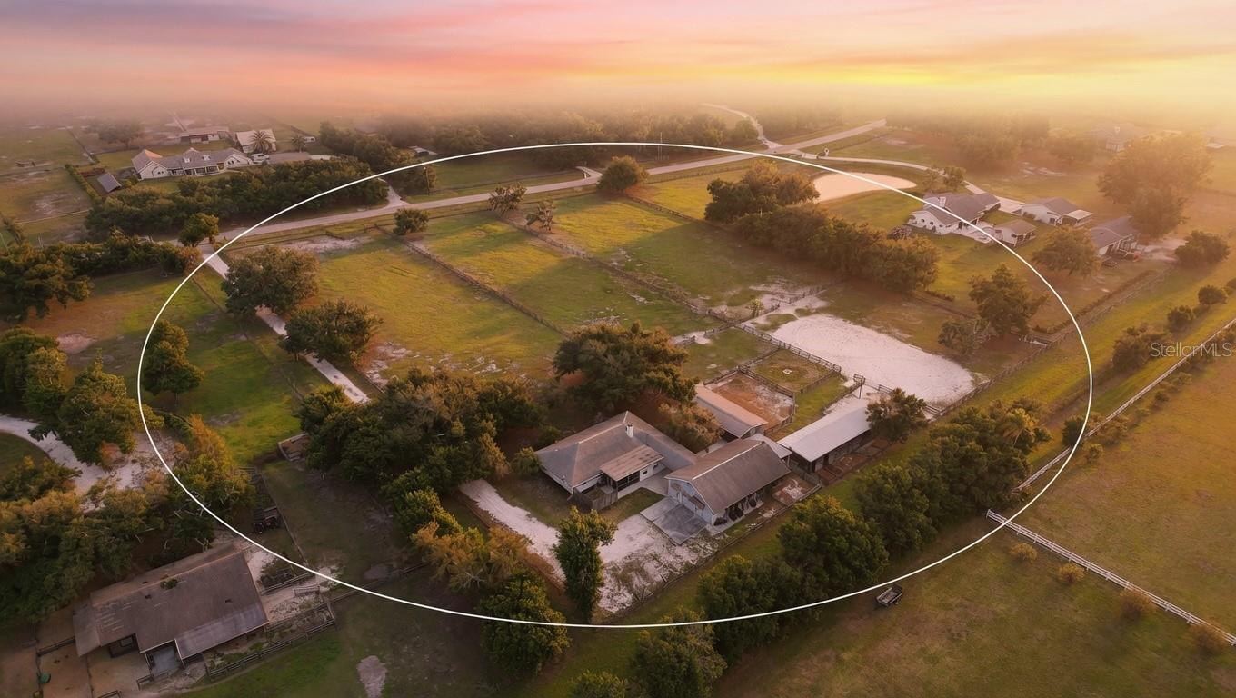 One or more photo(s) has been virtually staged. PHENOMENAL PRICE IMPROVEMENT!  The ultimate equestrian estate in prestigious gated Saddle Creek is now available- a true horse lover's paradise!
Drive through the gated entrance of Saddle Creek and discover one of Sarasota’s most exclusive equestrian enclaves — a peaceful, deed-restricted community of 5+ acre estates where horses graze beneath ancient oaks. Miles of private bridle paths — Palomino Trail, Bridle Path, Saddle Creek Way, and more — wind right from your back gate. This is authentic Florida horse country with easy access to I-75, yet you’re surrounded by like-minded owners who live the equestrian lifestyle year-round.
The on-site facilities are built for serious horse enthusiasts. You’ll find three expansive barns: 2 connected directly to the home by covered breezeways, plus 1 free-standing barn with a half bath! The concrete attached barn (50x30) has 4 stalls (10x11 each), an 18x12 tack room, 10x16 mud room, 14x11 feed room, and a 13x17 tool room.  The 2nd barn (70x 22) has 7 stalls (12x10 each), and the 3rd metal barn (48x 22) has 4 stalls (12x12 each).   Together they offer a full complement of stalls, tack rooms, feed storage, a convenient half-bath, and a wash station. The entire 5+ acre property is fully fenced and cross-fenced, with an arena, paddocks and open pasture ready for daily turnout and training.
These same barns also provide incredible versatility beyond horses — ideal for a car collector, carpenter’s workshop, additional storage, or any hobbyist needing large outbuildings with electricity and easy access.
Inside the comfortable 3-bedroom, 2-bath single-level home (shown here virtually staged to illustrate its excellent flow and potential), you’ll love the warm, open layout designed for easy living between house and barns. The spacious great room features a stunning double-sided stone fireplace that opens to both the living area and the primary suite. The kitchen offers stone countertops and stainless-steel appliances, while the adjacent dining area and bonus room provide flexible space for clients or family. A generous screened porch and multiple covered patios create seamless indoor-outdoor living. You’re a quick 20-minute drive from TerraNova Equestrian Center in Myakka City — Florida’s premier destination with 6 state-of-the-art competition arenas, an Olympic-level cross-country course, 250+ permanent stalls (expanding soon), and a year-round calendar of international-level hunter/jumper (including CSI2* and National), dressage, eventing, and combined driving events.
A short, easy drive south puts you at Fox Lea Farm in Venice — the family-friendly 50-acre boutique venue that hosts the popular 9-week Venice Equestrian Tour, weekly Grand Prix “Show Jumping Under the Stars,” plus Quarter Horse, Appaloosa, and dressage shows.
When the big leagues call, world-renowned WEC in Ocala is a manageable, scenic 2.5-hour drive — close enough for weekend clinics or major events without ever feeling far from home.
Add quick access to Sarasota Memorial Hospital, top-tier shopping, dining, and the stunning Gulf beaches — “The Water” is literally minutes away for sunset rides or client entertaining.
This rare gated-community equestrian estate delivers serious barn infrastructure, endless private trails, and prime positioning on Florida’s premier show circuit.
