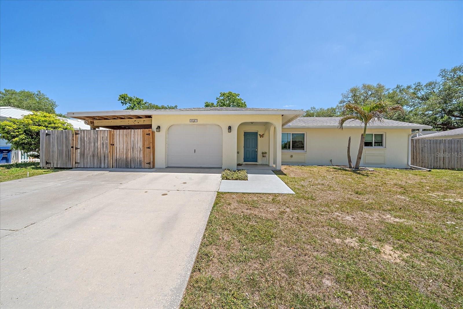 Move-in ready and thoughtfully updated, this Sarasota home offers an open floorplan designed for comfortable everyday living and easy entertaining. The interior features an updated kitchen and bathrooms, along with impact windows and doors for added peace of mind. Recent improvements include a newer roof, updated electrical panel, and new ductwork. Whole house water filtration system. Step outside to enjoy the new lanai (2019) overlooking a fully fenced backyard—perfect for relaxing or entertaining. Additional highlights include a large carport with an attached tool shop, providing extra storage and workspace. Easy to show!