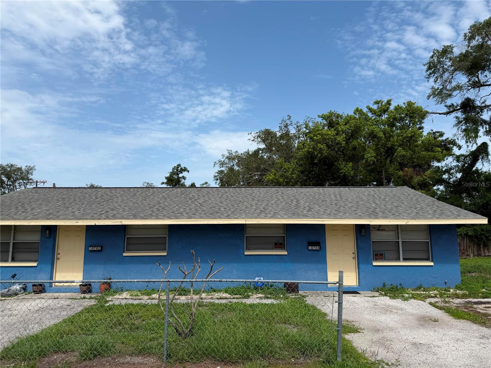 INVESTMENT INCOME PRODUCING DUPLEX centrally located in Tampa.  NO HOA.  NO CDD.  Current tenants leases end in October.  Current rent is $1500.  Well-maintained homes with updated kitchen and bathroom in both units.  Laminate flooring in both units.  Each unit has their own meters, and responsibile for their own utilities.  Each unit has 2 Beds and 1 Bath, 702 sq.ft. with built-in closets.  Additional storage on premises.  Appointment Only.