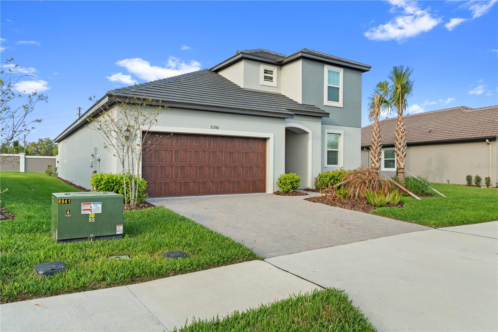 Located in Medley at Mirada, a gated 55+ community in San Antonio, this Meridian Model offers 3BR/3BA with flex space and loft with a versatile 2-story layout. The main level includes the primary suite and an additional bedroom and flex space, while upstairs features a third bedroom and loft—ideal for guests or office space. Open-concept design connects flex space to a well-appointed kitchen with upgraded cabinets, quartz countertops, stainless steel appliances, and spacious living/dining areas. Enjoy a private screened lanai, perfect for relaxing mornings or evenings. Features include ceiling fans and a separate laundry room with washer/dryer. HOA covers lawn care, cable, and high-speed internet. Amenities include a resort-style pool, clubhouse, fitness center, restaurant, bar, tennis, pickleball, bocce, shuffleboard, and dog parks. Private access to the nation’s largest lagoon with beach-style living, swimming, kayaking, paddleboarding, and a swim-up bar. Golf cart-friendly with trails. Convenient to I-75, shopping, dining, and Tampa International Airport.