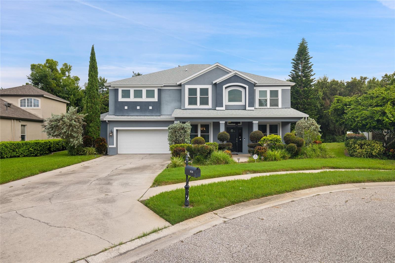 Welcome to this elegant, move-in-ready 5-bedroom masterpiece in the highly sought-after Thousand Oaks community of Trinity. Nestled in a top-rated school district, this beautifully landscaped home offers the ultimate peace of mind with NO CDD fees, LOW HOA ($300/yr), and a history of NEVER flooding.

From the charming covered front porch, step into an inviting formal living and dining layout adorned with upscale crown molding and chair rails. The foyer leads to a sprawling, open-concept chef’s dream kitchen and family room combo. The custom kitchen boasts premium solid wood 42" staggered cabinetry with soft-close features, a massive island with an attached dinette, a reverse osmosis system, and top-of-the-line appliances including a brand-new Frigidaire Professional gas cooktop, a 48” built-in fridge/freezer, and built-in double ovens. A butler's pantry seamlessly connects the kitchen and dining spaces for flawless entertaining.

French doors open to a massive, newly sealed 1,000 sq ft paver patio (2019)—an entertainer’s paradise. Exceptional upgrades run throughout, including luxury vinyl plank and premium laminate flooring, high-end chandeliers, new ceiling fans (July 2026), and whole-home integrated speakers. Upstairs, find a versatile loft, a convenient laundry room, and 5 bedrooms, including a massive Primary Suite featuring a garden tub, a frameless double-head shower, and dual vanities.

Major Upgrades: $52K Hurricane Windows (2022), Roof (2019), Instant Gas Water Heater (2016), Blown-In Attic Insulation (2019), New garage door motor and springs, Premium Luxury, Vinyl Plank flooring, new washer and gas dryer. Owned water softener and security system included. There is an invisible fence around the bacck yard for your pets. Selling AS-IS for convenience. Security cameras active. Buyer/buyer's agent to verify all measurements and public info.