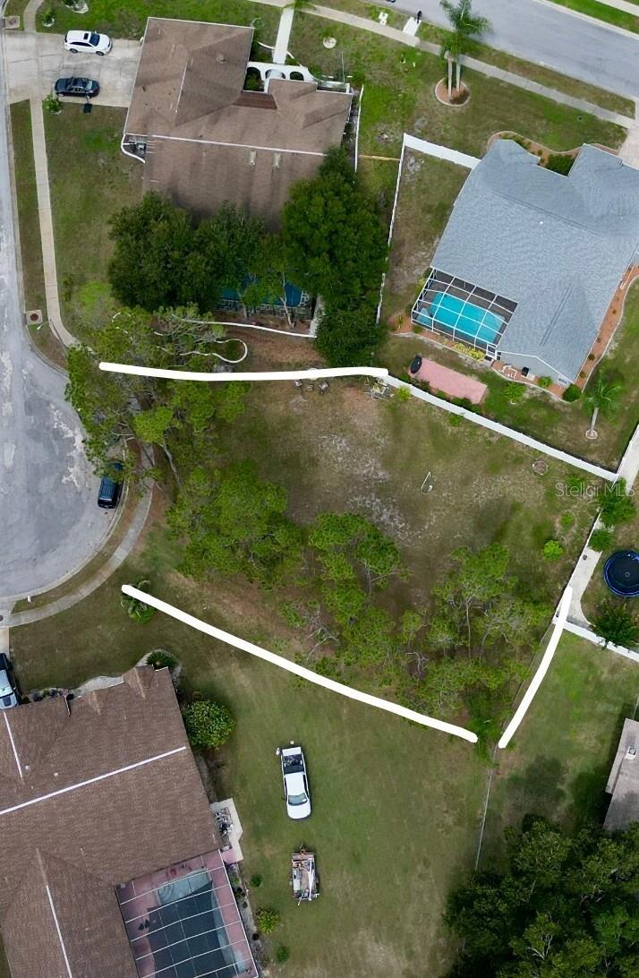 Rare opportunity to build your dream home on a spacious, 0.27-acre buildable lot tucked on a quiet cul-de-sac in the desirable Hunter's Ridge community of New Port Richey! This generous corner-style lot offers approximately 77 ft of street frontage and over 125 ft of depth, giving you plenty of room to design a home with a real yard, mature landscaping, and privacy from neighbors.
A big convenience for builders: plumbing has already been run to the lot, helping save time and cost when you're ready to break ground.
Hunter's Ridge is a well-established, low-HOA neighborhood known for its wide roads, mature tree canopy, and spacious lots — a refreshing change from the tightly packed new construction popping up elsewhere. Residents enjoy access to a community pool, tennis courts, and clubhouse, plus an easy commute via Little Road to shopping, dining, and SR-54 toward Tampa. Outdoor lovers will appreciate being just minutes from Jay B. Starkey Wilderness Park's 8,000+ acres of trails, and the scenic 47-mile Pinellas Trail for biking and walking. Top-rated schools, including Deer Park Elementary and River Ridge Middle/High, serve the area.
Don't miss your chance to own land in one of New Port Richey's most sought-after, family-friendly communities. Bring your builder and make it yours!