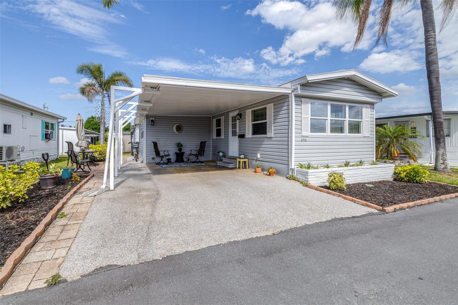 Welcome to your perfect Florida retreat in a sought-after 55+ community! This well-maintained, turn-key, fully furnished
mobile home offers effortless living with comfort, style, and convenience already in place.
Step inside to find a beautifully appointed interior featuring Tommy Bahama living room furniture, creating a warm,
coastal-inspired atmosphere ideal for relaxing or entertaining. The home has been freshly painted and thoughtfully updated
with newer windows that bring in plenty of natural light while enhancing energy efficiency. The kitchen is equipped with
stainless steel appliances, and a new microwave making meal prep both stylish and functional.
Additional upgrades include a newer 220 electrical panel for peace of mind, along with three exterior sheds, providing ample
storage space for tools, hobbies, or beach gear.
Located in an active and friendly community such as Bradenton Tropical Palms, residents enjoy a low-maintenance lifestyle with
low HOA fees and a wide range of amenities. The neighborhood features an Olympic-sized swimming pool, hot tub, shuffleboard
courts, and pickleball, encouraging a vibrant and social way of life. All perfectly situated approximately 8 miles from the
beautiful Gulf beaches
Whether you're looking for a seasonal getaway or a full-time residence, this home truly checks all the boxes—just bring your
suitcase and start enjoying the Florida lifestyle!