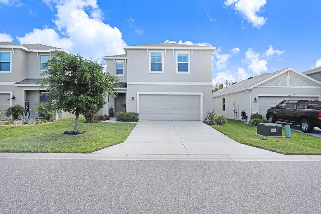 Welcome to this beautifully maintained 2021 built home located in the highly desirable community of South Branch Preserve in Odessa. Offering 2,260 square feet of thoughtfully designed living space, this 4-bedroom, 2.5-bathroom home with a spacious loft perfectly blends functionality, comfort, and modern style. Step inside to a welcoming entryway that opens into a bright and airy open-concept floorplan, ideal for both everyday living and entertaining. The kitchen serves as the centerpiece of the home, featuring a large granite island with a deep stainless steel sink, sleek stainless steel appliances, ample cabinetry, and a pantry. The kitchen flows seamlessly into the dining and living areas, all enhanced by abundant natural light and direct access to the backyard through sliding glass doors. A conveniently located half bath on the main floor adds to the home’s thoughtful layout. Upstairs, you’ll find a versatile loft area perfect for a second living space, home office, or playroom, along with four generously sized bedrooms. The spacious primary suite offers a private retreat with an en suite bathroom featuring dual vanities, a walk-in shower, water closet, and a large walk-in closet. The additional bedrooms are well-sized and share a full bathroom with dual vanities and a shower/tub combination. The upstairs laundry room adds everyday convenience. The fully fenced backyard provides a great space for outdoor enjoyment, pets, or entertaining. South Branch Preserve is ideally located just minutes from the rapidly growing SR 54 corridor, offering easy access to a wide variety of shopping, dining, and everyday conveniences. With close proximity to the Veterans Expressway, commuting to Tampa, Tampa International Airport, and surrounding areas is quick and convenient. Residents enjoy a peaceful neighborhood setting paired with outstanding amenities, including two resort-style pools, a sports field, basketball court, dog park, and fitness center. This move-in ready home has been exceptionally well maintained and is a fantastic opportunity to enjoy modern living in one of Odessa’s most convenient and sought-after locations