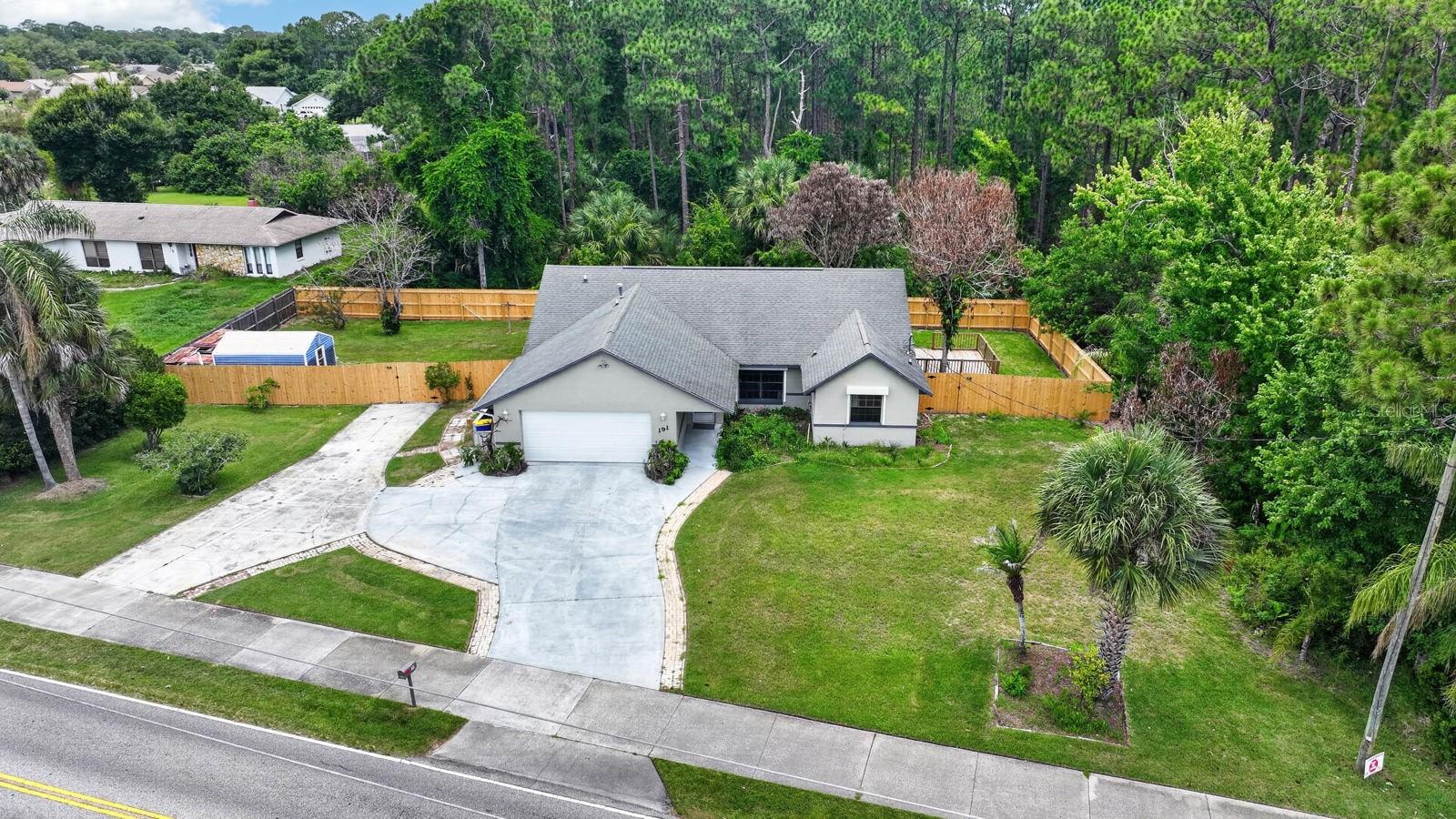 PRICED TO SELL! This move-in-ready home sits on an oversized lot and offers an impressive list of upgrades, including a brand-new A/C system and new fencing for added comfort and privacy. The spacious backyard provides plenty of room for boats, RVs, trailers, or all your outdoor toys, and features storm shutters on all windows for added peace of mind. Inside, you’ll find an inviting open-concept floor plan with vaulted ceilings, granite countertops, and abundant natural light. Enjoy year-round relaxation in the large screened Florida room, or entertain guests on the expansive wood deck overlooking the backyard. A storage shed provides additional space for tools and equipment. Conveniently located with easy access to shopping, dining, schools, and major roadways, this property offers the perfect combination of space, functionality, and value.