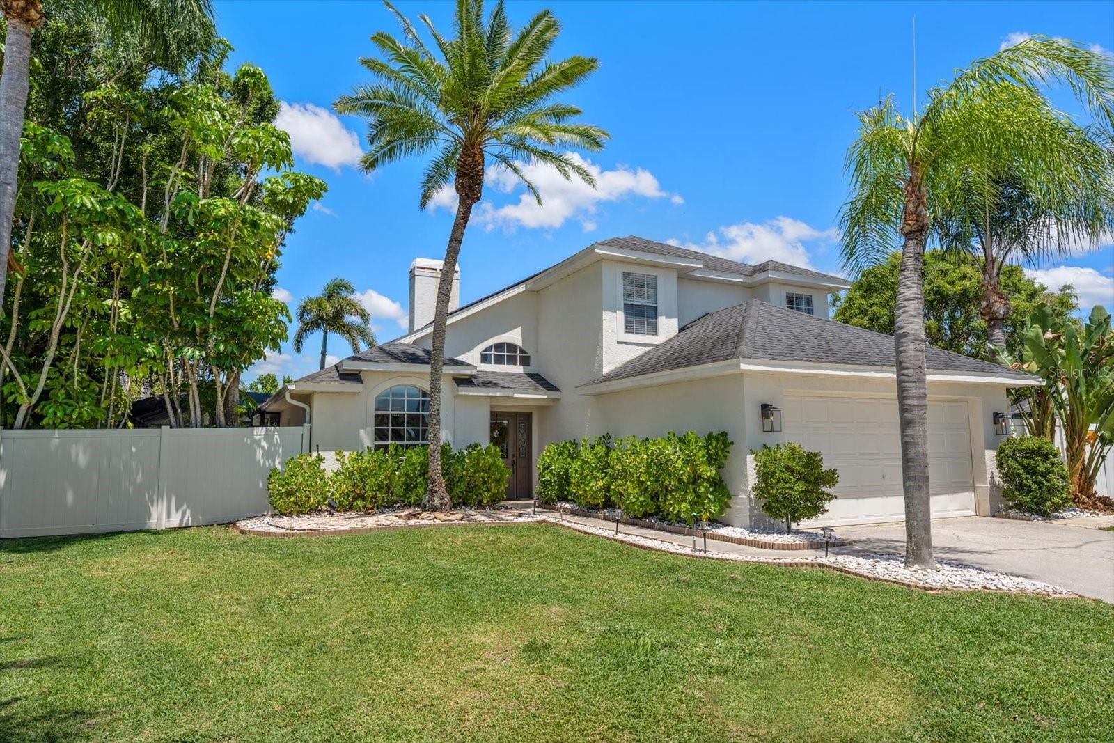 Tucked away in the desirable enclave of Bay’s End, this stunning contemporary two-story residence blends upscale coastal living with exceptional indoor-outdoor entertaining. From the moment you enter, soaring ceilings, an open-concept design, and abundant natural light create a warm yet sophisticated atmosphere. Rich wood-look luxury vinyl flooring flows seamlessly throughout the home, enhancing its modern coastal appeal.
At the heart of the home is a beautifully designed island kitchen featuring elegant wood cabinetry, gleaming quartz countertops, and stainless steel appliances. The kitchen opens effortlessly to the spacious living and dining areas, highlighted by a striking wood-burning fireplace and views of the tropical pool and spa retreat.
The main-level owner’s suite is a private sanctuary complete with a walk-in closet and an expansive spa-inspired bathroom filled with natural light, featuring a luxurious vanity, soaking tub with shower. A convenient half bath, interior laundry room, and attached two-car garage complete the first floor.
Upstairs, you’ll find two additional bedrooms, a full bath, and a versatile den/media room perfect for a home office, playroom, or entertainment space.
Step outside through sliding glass doors to your own private resort-style oasis. The screened lanai surrounds an entertaining-sized pool with waterfall and spa, framed by towering palm trees and lush tropical landscaping. By night, the spectacular pool and landscape lighting transform the backyard into a truly magical setting.
Situated on nearly a quarter-acre, the enormous privacy-fenced backyard offers endless possibilities — currently serving as the ultimate playground for soccer, baseball, basketball, and golf.
Exceptional savings with the solar panels, installed in 2020.  Seller will pay the financing in full at closing.
This exceptional Bay’s End home combines style, comfort, and resort-inspired living in one unforgettable package. Opportunities like this don’t last long.