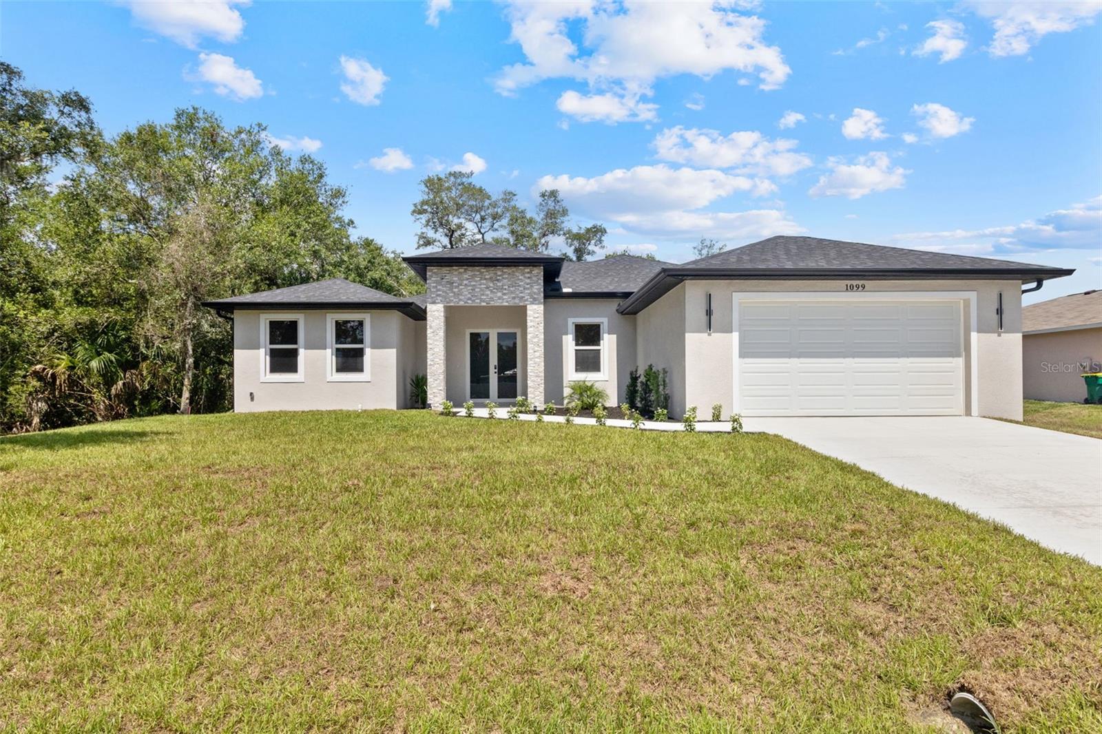 Look no further, this is the home you have been waiting for. From the moment you arrive, the stunning double door entry welcomes you into this beautiful custom built 4 bedroom, 2 bathroom home.

Designed to stand apart from the typical mass produced new construction homes, no expense was spared in the quality and finishes of this property. The home features impressive 10 foot ceilings, solid 8 foot interior wood doors, tile flooring throughout, wood cabinetry, quartz countertops with an elegant waterfall edge, soft close cabinets and drawers, full height upper kitchen cabinets that extend to the ceiling, and a spacious walk in pantry. Every detail was carefully selected to provide both style and functionality.

The laundry room was designed with convenience in mind, featuring additional cabinetry and a utility sink. The open floor plan, premium finishes, and custom features make this property truly one of a kind.

For added peace of mind, the home is equipped with hurricane impact windows and is located in Flood Zone X, eliminating the requirement for flood insurance. The garage also includes a convenient side entry door for easy access. Best of all, there is no HOA, giving you the freedom and flexibility that many buyers are seeking.

Enjoy the large covered lanai, perfect for entertaining guests, outdoor dining, or simply relaxing and enjoying the peaceful surroundings. Situated in a quiet neighborhood, this home offers both comfort and tranquility.

If you are looking for a home that offers exceptional value, quality construction, and custom details throughout, this is an opportunity you will not want to miss.