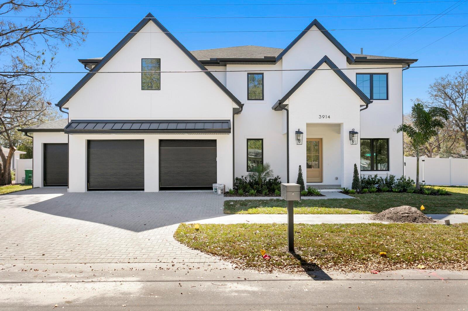 NOW COMPLETE! Momentum Homes presents the Magnolia, a masterfully crafted 5-bedroom, 4.5 bathroom pool home with a media room, plus study, all with designer-selected finishes. Centrally-located in the heart of South Tampa on a nearly quarter-of-an-acre corner lot, this property is sure to check all of your boxes. Step inside this luxury home to French Oak wood floors, crown molding, and 10-ft ceilings throughout. The kitchen features all Thermador appliances; a 48-inch gas range, and custom shaker cabinets with quartz countertops, seamlessly connecting to the butler’s pantry equipped with a wine fridge. The kitchen is the heart of the home and opens to a grand living room great for entertaining or enjoying a quiet evening in front of the 60-inch gas fireplace. The first floor includes an en suite bedroom perfect for guests, plus an office. Head upstairs and unwind in the media room, which includes a snack bar and beverage center. Four additional bedrooms are on the second floor, including the primary suite. Outdoors the property is secured with vinyl fencing for privacy while you enjoy the heated pool and spa surrounded by natural stone and a fully-equipped outdoor kitchen. Along with ample living space and beautiful appointments, you will find a sense of peace within this two-story block construction home built high and dry with an engineered truss system and hurricane strapping, all Impact-rated windows, and located in Flood Zone X, Evacuation Zone C. The property is zoned for A-rated Grady-Coleman-Plant. Schedule a showing today and kick off the new year in your dream home!