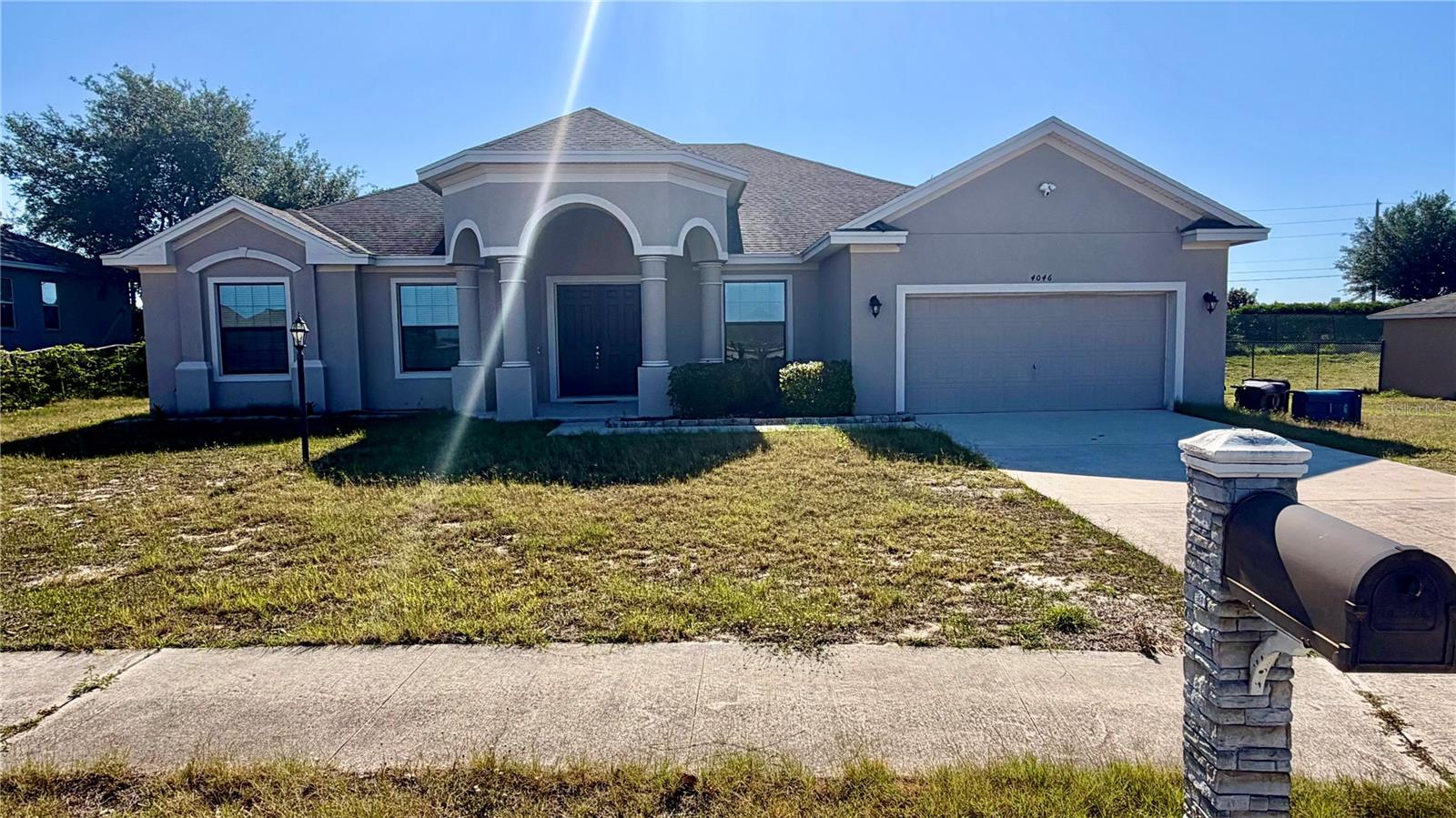Stunning spacious 4 bedroom home located in the heart of Lake Wales Fl. This 4 bedroom 2 bath home offers a separate dining room and living room decorated with exterior columns and beautiful light fixtures. The foyer opens up into a large family room, with high ceilings,  ceiling fan, large wall for that 100” tv and  recessed lighting creating an open comfortable space. The kitchen offers solid dark wood cabinets state of the art refrigerator, stainless steel appliances, seating area at counter top, combined  with the living room  creating  a great entertaining area for family gatherings and social events. The split floor plan offers 2 bedrooms, with tub/shower combo bathroom in between. To the back left of living room a large room perfect for an office, game room  or guest bedroom. The Oversized Primary bedroom with high ceilings, recessed lighting makes it a perfect room to just retreat too, after a long day. The bedroom also has his and hers split side by side large walk in closet.  The large Primary bathroom, consist  dual vanities,  a walk in shower with duel shower heads , one on each side, garden tub, linen closet, high ceilings. Finally there is a screened in patio with above ground hot tub. Close to shopping, schools, Disney, Lego land and highways systems. Home is SOLD AS IS. All furnishing are available for sale in a separate transaction. Schedule your showing today!