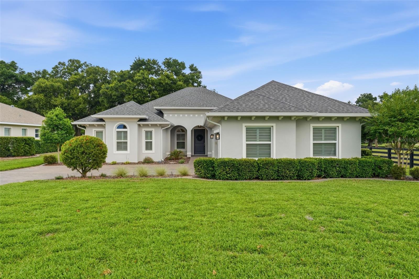 One or more photo(s) has been virtually staged. Welcome to Harbor Hills, proudly named the 2025 Dream Community by the Home Builders Association of Lake & Sumter Counties. From the moment you enter this private, gated Country Club community, you’re surrounded by peaceful, park-like scenery, tree-lined roads, and beautifully maintained green spaces. 

This exceptional 4-bedroom, 3-bath residence in the Bella Vista community offers refined living with direct views of the 3rd hole on the 18-hole championship golf course, rated 4 stars by Golf Digest. Thoughtfully upgraded throughout, the home features LVP flooring in all main living areas, luxury tile in bathrooms, and high ceilings with elegant tray details that enhance the spacious, open feel.

The gourmet kitchen includes a walk-in pantry, recessed lighting and seamless flow into the main living spaces. Most bedrooms offer generous walk-in closets, and the home is equipped with ceiling fans, luxury shades and shutters, and a whole-house generator for peace of mind.

Step outside to the screened lanai, complete with a mounted TV and sweeping golf course views—your private retreat for morning coffee or evening relaxation.

The social membership to the Country Club offers use of the heated junior olympic pool, whirlpool, sauna and the modern fitness center, as well as numerous discounts. 
 
Located just minutes from The Villages, Harbor Hills offers the convenience of nearby shopping and dining without the traffic, and as an all-ages community, it provides a welcoming environment for every lifestyle.

Key Features:

*Golf course frontage on the 3rd hole

*4 bedrooms, 3 full baths

*LVP flooring throughout (tile in bathrooms)

*High ceilings + tray ceilings

*Whole-house generator with 500-gallon LP tank 

*Luxury shades and shutters

*Recessed lighting & upgraded doors

*Walk-in pantry and walk-in closets

*Screened lanai with TV overlooking the course

*Private, gated country club community

*Minutes from The Villages—without the congestion

*18-hole championship golf course, Harbor Hills Country Club