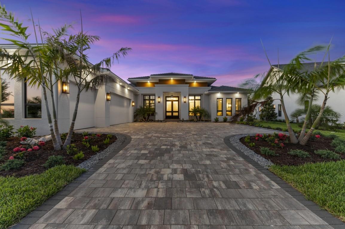 The fully furnished Solstice III Model Home by Lee Wetherington Homes in Everly at Wellen Park is now available for purchase with leaseback. This breathtaking custom home blends modern elegance with luxurious living, beginning with a grand 10-foot iron double door entry featuring crushed amber glass.  Designer finishes shine throughout, including warm wood tones, Cambria quartz, elegant tilework, and bold black and gold accents. Walls of 10-foot sliding glass doors seamlessly connect to an expansive outdoor retreat complete with a pool, spa, outdoor kitchen, fire table, and stunning lake views.

Located within the gated community of Everly in Wellen Park, residents enjoy access to a resort-style clubhouse, fitness center, pool with cabanas, pickleball courts, and dog park - all just a short drive to the Gulf Coast’s pristine beaches.