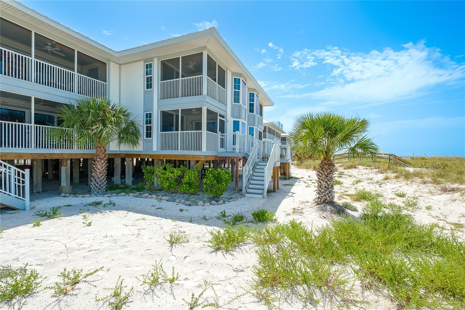 Beachfront Paradise on Palm Island. Wake up to breathtaking Gulf views and the soothing sound of the waves in this beautifully updated 2-bedroom, 2-bath beachfront condominium at Palm Island Resort. Start enjoying the blue water and sandy shores, this coastal retreat offers the ideal blend of comfort, style, and island living. The bright, open floor plan is designed for effortless entertaining, featuring luxury vinyl plank flooring in living room, dining area and kitchen. The kitchen is well-appointed with ample cabinetry and generous counter space. Sliding doors fill the home with natural light and open to a private balcony where you can enjoy spectacular sunsets and panoramic beach views. The spacious primary suite provides a peaceful retreat with an en-suite bath, while the guest bedroom and second full bath with privacy and comfort for guests. Offered tastefully furnished, this turnkey residence is ready to enjoy as your personal island getaway or a desirable vacation rental. Located within the exclusive Palm Island Resort, owners enjoy access to pristine beaches, swimming pools, tennis and pickleball courts, fitness facilities, on-site dining, and miles of unspoiled shoreline. Accessible only by private boat or a short car ferry ride, Palm Island offers a rare opportunity to experience the tranquility and natural beauty of Florida's Gulf Coast just minutes from the mainland. Searching your own piece of paradise? This exceptional beachfront condominium delivers the ultimate coastal lifestyle.