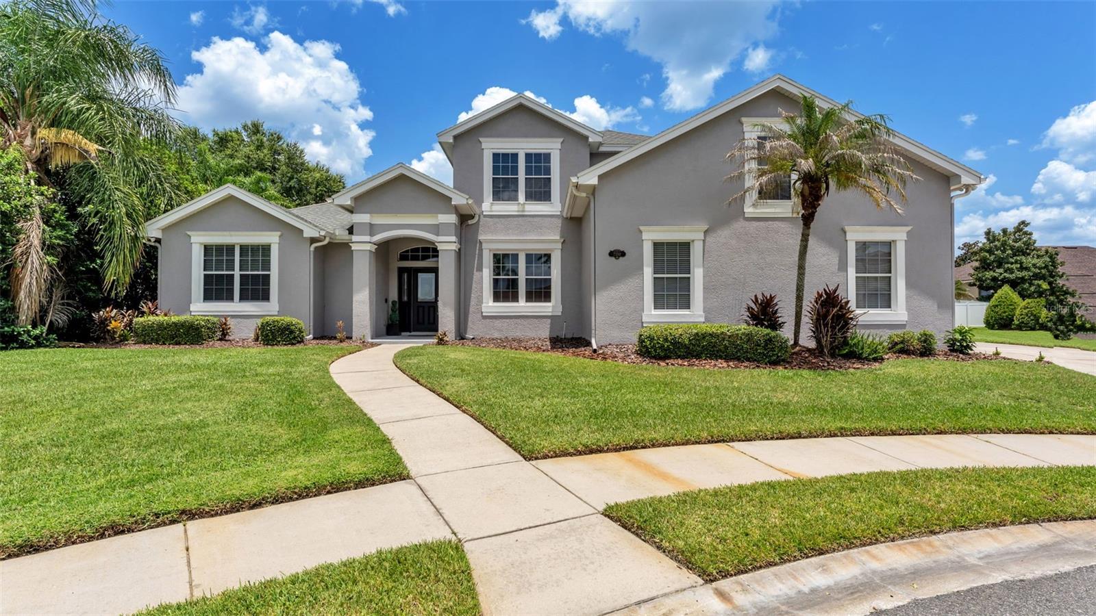 Exciting update! Recent documentation confirms this home offers additional heated living square footage, providing even more value, versatility, and room to grow. The spacious finished upstairs bonus room is not reflected in the Property Appraiser's records, increasing the homes livable square footage and making this a true 5-bedroom home. Welcome to Eaglebrooke, Lakeland's premier golf community! Tucked away on a quiet cul-de-sac, this home sits on an oversized lot and features a private backyard retreat complete with a heated saltwater pool and spa featuring a shallow sun shelf, built-in bench seating, water features, and an expansive screened enclosure. With 5 bedrooms, 2.5 bathrooms, including a versatile bonus room that can serve as the fifth bedroom, home office, or media/recreation room, there's room for the whole family. A 3-car garage and spacious yard complete the property, creating endless opportunities for outdoor living and entertaining. Upon entering, you're greeted by an impressive great room with sliding glass doors overlooking the stunning pool, spa, and oversized patio. The large eat-in kitchen is built for entertaining and opens directly to the great room, featuring updated appliances and hardware, an updated single-basin sink, a breakfast nook, recessed and under-and-above cabinet lighting, and abundant storage. The owner's suite is located on the main floor for added privacy and features his and hers closets, double vanities, and a large tiled shower. Also included on the main floor is a dedicated formal dining room, a convenient half bathroom with direct access to the pool - perfect for pool days and guests, as well as a utility room with plenty of storage - making weekly routines a breeze. The second level features four spacious bedrooms, one of which is a versatile bonus room, along with a full bathroom featuring double vanities and a linen closet. The bonus room also includes two walk-in closets, providing exceptional storage. Outside, the expansive screened enclosure offers plenty of space for dining, lounging, and entertaining. Beyond the pool, the spacious backyard still leaves room for pets, and yard games, while mature landscaping adds beauty and privacy. Other features include a safety fence around the pool, storage closets, crown molding throughout, and a smart irrigation system that can be controlled directly from your phone. Residents enjoy a golf cart-friendly community with a 24-hour guarded gate, a premier 18-hole golf course, driving range, full-service country club with restaurant and bar, swimming pool, and tennis and basketball courts. Eaglebrooke truly offers something for every lifestyle!