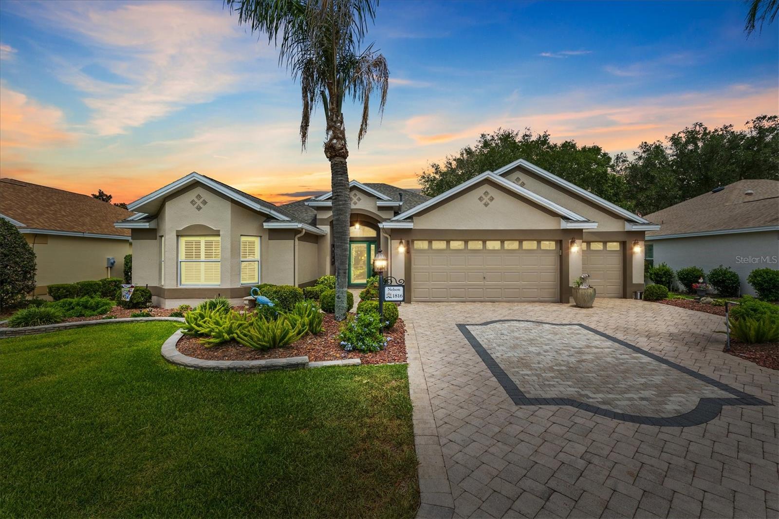 Welcome to this beautifully maintained Lantana Designer Home offering a rare combination of privacy, upgrades, and peace of mind with a stunning preserve view and a PAID BOND. From the moment you arrive, you'll appreciate the exceptional curb appeal highlighted by mature, meticulously maintained landscaping, a beautiful paver driveway, and an oversized 2-car plus golf cart garage. Combined with the extensive improvements throughout, this home is truly move-in ready.

Step inside to find engineered hardwood flooring flowing through the living room, dining room, primary suite, and front guest bedroom, complemented by tile flooring in all remaining areas. Crown molding enhances the main living spaces, while plantation shutters throughout the home provide timeless style and privacy.

The spacious kitchen features white cabinetry, Corian countertops, stainless steel appliances, a electric range, and natural gas utilities, creating an inviting space for everyday living and entertaining. Multiple solar tubes bring additional natural light into the home, making every room feel bright and welcoming.

The primary suite offers a peaceful retreat with a huge walk-in closet and a beautifully updated bathroom featuring quartz countertops. The guest bathroom has also been upgraded with quartz surfaces, providing a consistent upscale feel throughout the home.

One of the standout features is the enclosed glass lanai under heat and air, complete with a mini-split system for year-round comfort. The lanai windows are enhanced with 3M tinting to improve efficiency and comfort while looking out to the beautiful preserve views. Beyond the enclosed lanai, you'll find an expanded screened birdcage that extends both to the side and across the rear of the home, creating exceptional outdoor living and entertaining space. An awning provides additional shade and comfort when desired, allowing you to enjoy the outdoor space throughout the day while taking in the peaceful natural surroundings.

The garage is equally impressive with durable OX Flooring coating, offering both beauty and easy maintenance.

Major updates have already been completed for the new owner, including a new roof in 2024 and a new HVAC system in 2024, providing years of worry-free ownership.

With its private preserve setting, paid bond, beautiful landscaping, paver driveway, extensive upgrades, expanded indoor and outdoor living spaces, and sought-after Lantana floor plan, this exceptional home offers the perfect opportunity to enjoy The Villages® lifestyle at its finest.