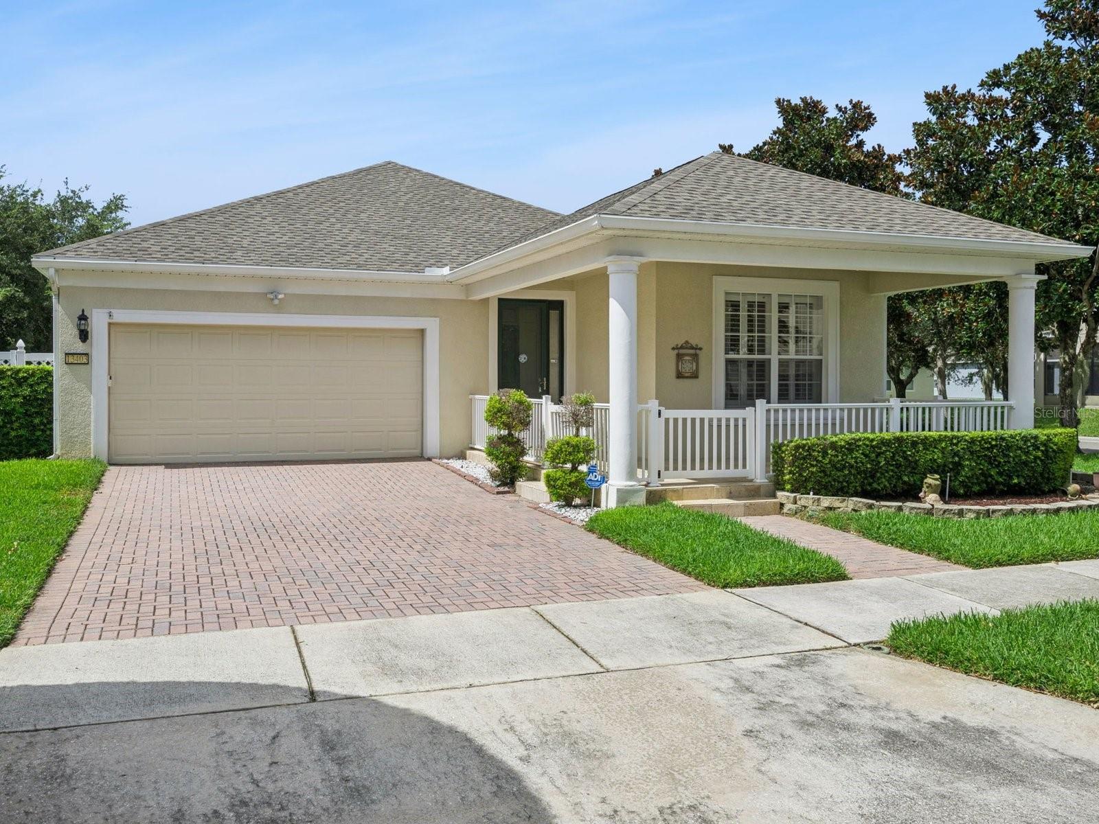 Set on a corner lot in Lake Sawyer South, this single-story Windermere home combines a new roof completed in May 2026 with a remodeled kitchen and bathrooms, custom woodwork, and inviting indoor-outdoor living. The three-bedroom, two-bath layout offers approximately 1,706 square feet with wood flooring through the main living areas and bedrooms, plantation shutters, crown molding, window casings, chair rail details, and an enhanced entry framed by custom trim. The main living room connects comfortably to the kitchen and breakfast area, while a separate front flex space can adapt to work-from-home needs, hobbies, or additional gathering space. The remodeled kitchen features white cabinetry, a blue subway-tile backsplash, an apron-front sink, stainless steel appliances, and breakfast-bar seating, with the refrigerator included. In the primary suite, the remodeled en suite bath offers dual sinks, a dedicated makeup vanity, and a glass-enclosed shower, while two additional bedrooms share an updated guest bath. Custom French-style sliding doors extend the living space to a tiled screened patio with all-season panels, creating a comfortable place to relax throughout the year. Beyond the enclosure, a full-length brick-paver patio and privacy-fenced yard provide additional outdoor space, while the covered front porch adds another welcoming spot to enjoy the corner-lot setting. Additional improvements include elastomeric exterior paint, a quiet-drive garage door opener, and an included washer and dryer. Community amenities include a pool, playground, tennis court, and basketball court, rounding out a home that blends thoughtful updates, character, and everyday convenience in the Horizon West area.