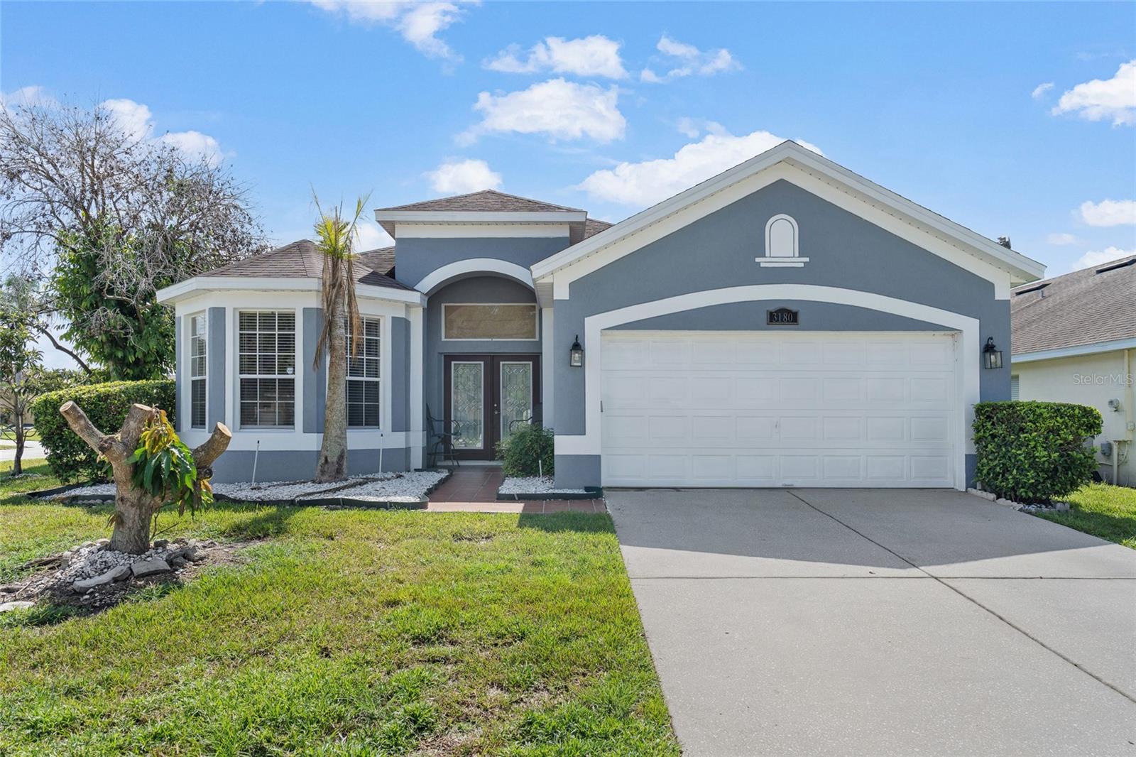 Welcome to this beautifully maintained 3-bedroom, 2-bath home in the desirable Stonehurst community of Kissimmee. Featuring a bright, open-concept floor plan with soaring ceilings and abundant natural light, this home offers both comfort and functionality. The spacious kitchen is complete with granite countertops, ample cabinet space, and a breakfast bar that opens to the main living area, perfect for entertaining. The primary suite features a walk-in closet and a private en-suite bathroom with dual vanities and a walk-in shower with glass enclosure. One of the secondary bedrooms also includes its own en-suite bathroom, providing an ideal setup for guests or multigenerational living. Step outside to the screened-in lanai, where you can unwind while enjoying a peaceful partial pond view and a beautifully landscaped backyard. Additional highlights include a two-car attached garage with plenty of storage space and a prime location just minutes from shopping, dining, major roadways, and Orlando's world-famous attractions. This is a wonderful opportunity to enjoy Florida living in a fantastic location.