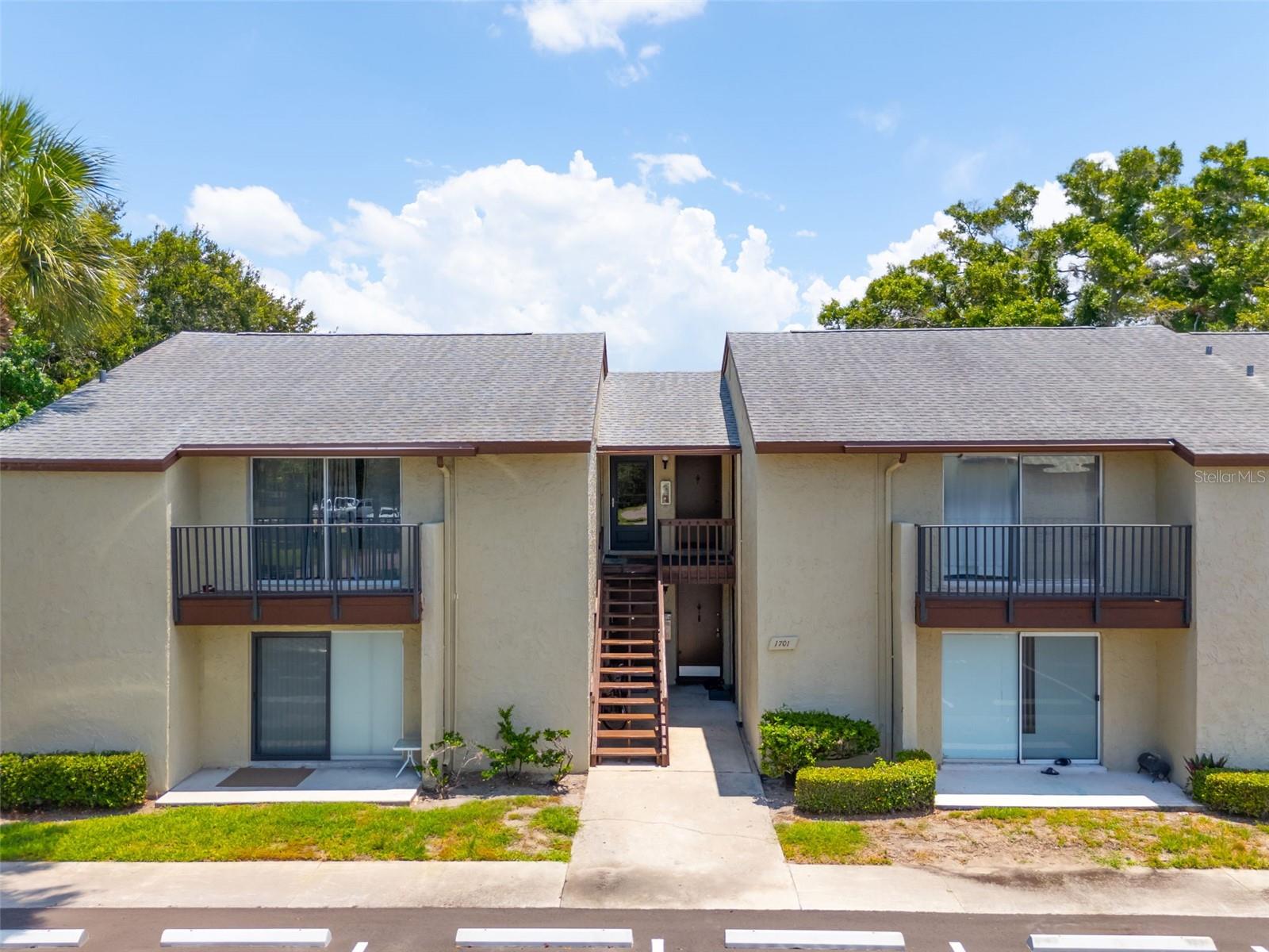 Looking for a simple Florida retreat with a pool just steps away? This cute and clean second-floor garden-style condo at Woodside Village offers easy, low-maintenance living in a relaxed community setting. With 490 sq. ft., the layout is efficient and comfortable, featuring a living area with private balcony, kitchen, bedroom, and bathroom.

The location within the community makes everyday life feel effortless. Enjoy morning coffee on the balcony, head across the way for a swim, take advantage of the nearby laundry room, or spend time at the clubhouse and sauna. It is the kind of place that feels easy to enjoy from day one, with plenty of opportunity to personalize over time.

Woodside Village offers a quieter residential feel with no pets permitted and leasing restrictions that help reduce turnover. Owners must own for one year before leasing.

Whether you are looking for a seasonal getaway, a simple full-time home base, or a budget-friendly condo to make your own, this is a sweet little opportunity in a convenient Clearwater location. New electrical panel installation in process.
