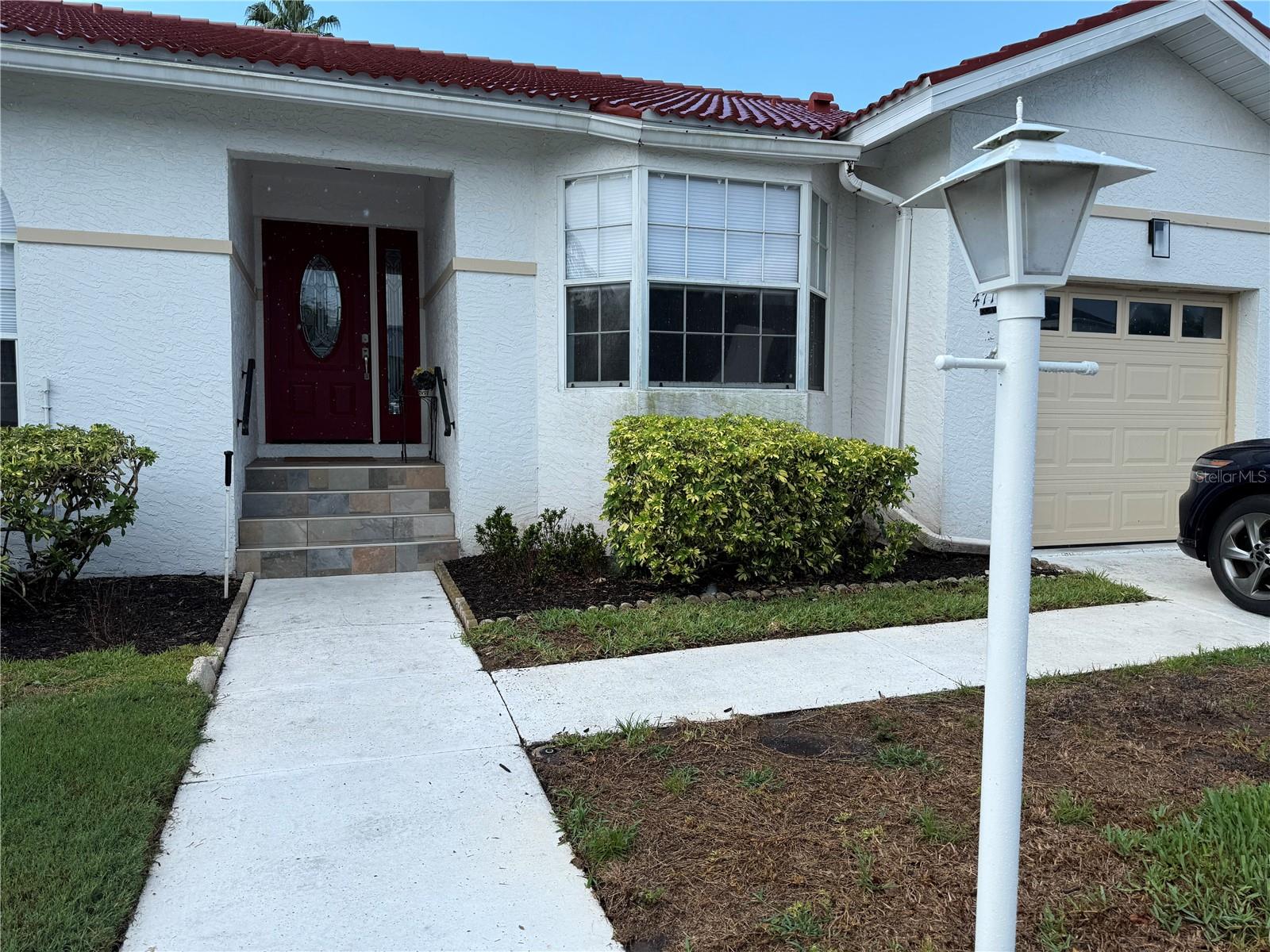 From the moment you step through the brand new door, you will enjoy the updating in this spacious, open 3 bedroom - 2 bath villa located in the neighborhood of Palm Court located in the IMG Country Club area.  The vaulted ceilings give it a very airy and open feeling.  The lanai has been newly painted and screened and a new door has been installed.  The blinds in the living and dining rooms are brand new.  The kitchen has appliances that are only 3 years old. Lots and lots of storage in this villa.   The bathrooms have all had new shower doors installed.  It has an attached one car garage.  To top it off the roof was replaced this past year.  Palm Court has a community pool.  The IMG Country Club has an 18 hole regulation golf course and a semi-private dining & grill room on Sarasota Bay open to the public.  Only 8 miles to the beaches.  Close to shopping, restaurants, groceries and about 20 minutes to downtown Sarasota.  This villa is a must see!!