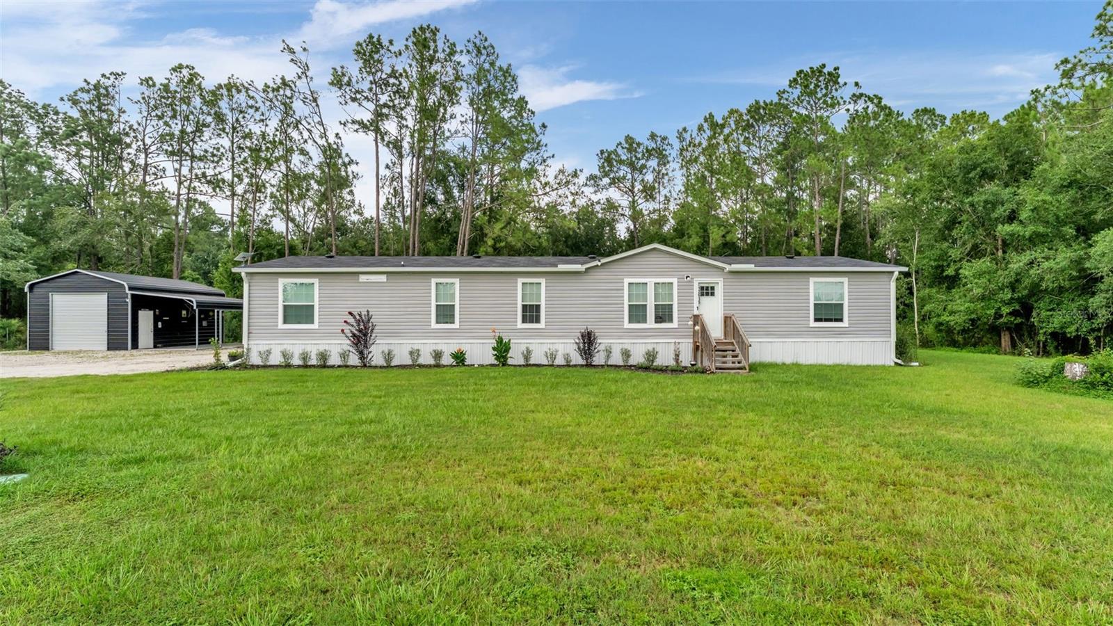 Welcome to your private slice of country paradise! Built in 2024, this beautifully maintained 4-bedroom, 3-bathroom home with a dedicated office/den offers 2,128 square feet of thoughtfully designed living space on an expansive 1.71-acre lot in desirable North Lakeland. With no HOA, you’ll enjoy the freedom to bring your RV, boat, ATV, trailer, or recreational equipment.

Step inside to an inviting open-concept floor plan featuring a desirable split-bedroom layout that provides comfort and privacy. At the heart of the home is a spacious kitchen showcasing modern cabinetry, stainless steel appliances, a large island with breakfast bar seating, and a walk-in pantry

The generous primary suite offers a relaxing retreat with a luxurious en-suite bathroom featuring split dual vanities, a walk-in shower, and a soaking tub. Three additional bedrooms, two full guest bathrooms, and a versatile office/den provide plenty of space for family, guests, hobbies, or working from home.

Step outside to enjoy the peaceful country setting from the covered back patio or cool off in the above-ground pool. The spacious property offers plenty of room for gardening, animals, outdoor recreation, and entertaining. An impressive 18' x 25' detached garage and separate 12' x 25' carport provide exceptional storage for vehicles, boats, equipment, or workshop needs.

Located in peaceful North Lakeland, this move-in-ready property offers the tranquility of country living while remaining conveniently located near shopping, dining, schools, and major roadways. Whether you’re looking for room for the whole family, space for your recreational vehicles, or a serene retreat with modern comforts, this exceptional Polk County property offers more than just a home—it offers a lifestyle. Call to schedule your private showing today!