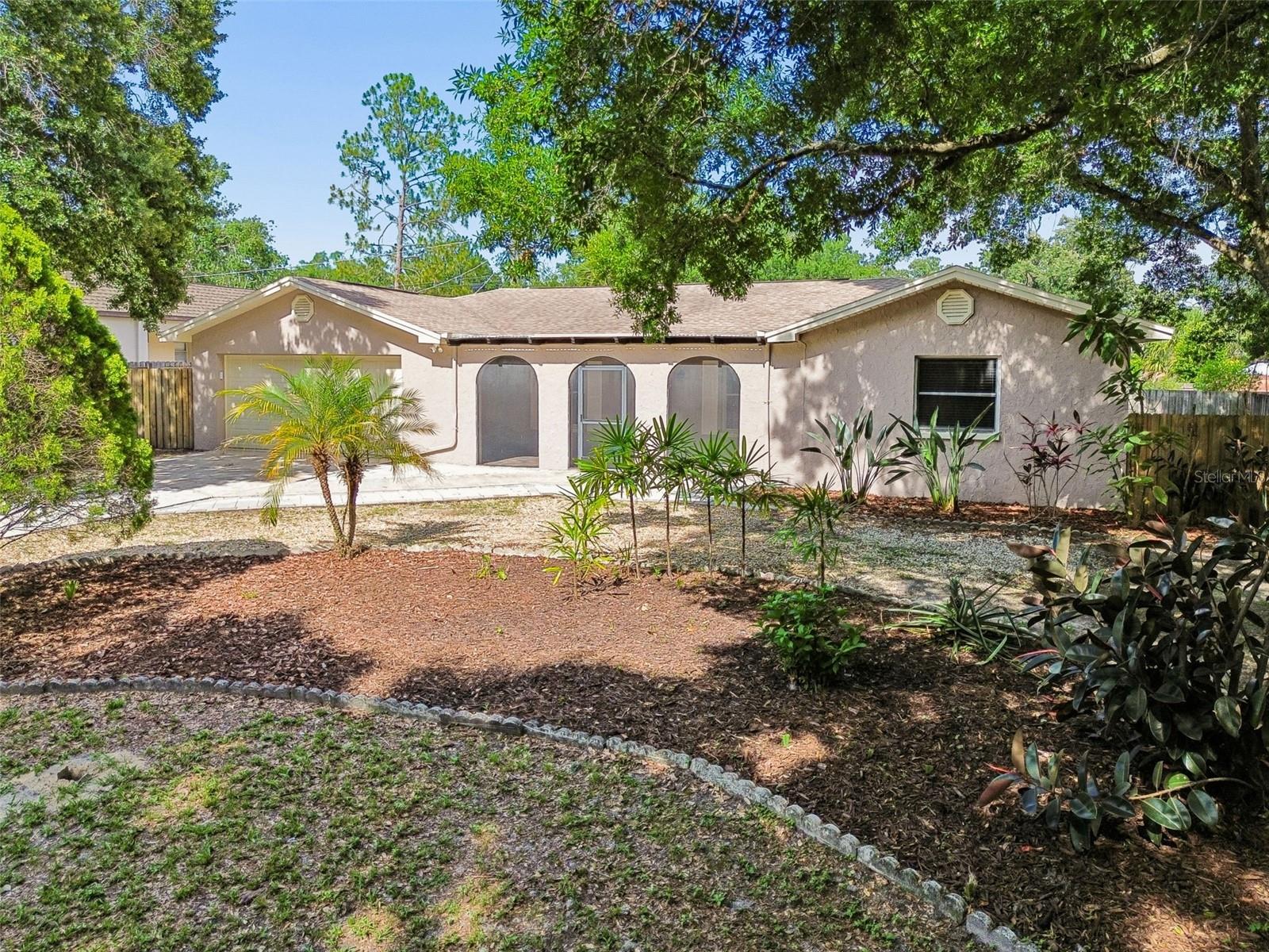 TEMPLE TERRACE – Bring Your Golf Cart! Perfectly positioned just off the 12th fairway of the Temple Terrace Golf Course, this Mediterranean-style Florida ranch is ready for its next owner. Offering over 2,000 square feet of living space, plus a spacious 12' x 35' Florida room, Deck and a large fenced backyard, this home provides plenty of room to relax and entertain.
Recent updates include fresh exterior paint, an updated kitchen, renovated bathrooms, and new laminate flooring (2026). Major system improvements provide added peace of mind, including a new roof (2021), HVAC system (2018), water heater (2026), and A/C mini split in the Florida Room (2026).
As an added bonus, the Temple Terrace Golf & Country Club welcomes new residents with a complimentary three-month social membership, making it easy to enjoy the community's exceptional amenities and social events.
Conveniently located near USF, Moffitt Cancer Center, and the James A. Haley VA Hospital, this home also offers quick access to downtown Tampa. Outdoor enthusiasts will appreciate nearby Riverhills Park, which provides boat access to the Hillsborough River, while the Temple Terrace Family Recreation Complex features basketball, tennis, and pickleball courts, a staffed fitness center, and activities for all ages.
With its rare combination of golf course access, generous lot size, no HOA or CDD fees, and a central location close to parks, river access, hospitals, dining, shopping, and major commuter routes, this property offers both an exceptional location and an outstanding lifestyle.
One or more photos have been virtually staged.