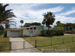 This riverfront Edgewater property is a water-lovers dream! 3 bed, 2.5 bath, and over 4000sq is good but LOCATION is better! 1.09 ac with water on 2 sides; 140 ft of river frontage and 180 ft of frontage on your own private canal with a seawall! Boat dock extends out directly into the ICW, and frame boat house just needs a cover. This area of the river is rife with beautiful wildlife. Youre sure to see plenty of dolphin, manatee & heron from your backyard, and enjoy fishing off your extended boat dock. If that isnt enticing enough, you will also have a place for your land toys; 2 large parking slabs to accommodate an RV, ATV or more watercraft. Property this unique and gorgeous doesnt come along often, so come take a look! ;Water: City