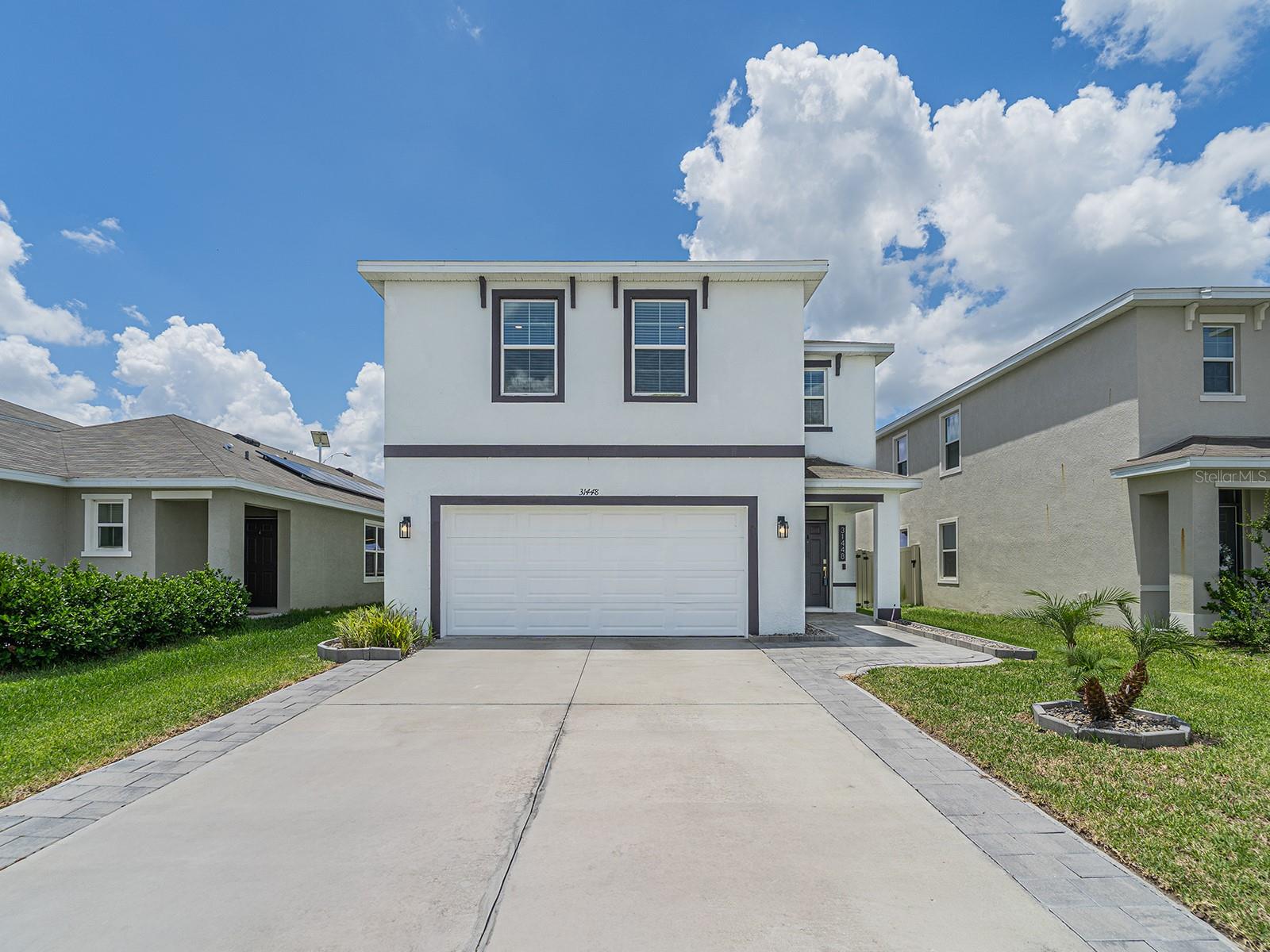 Welcome to this beautifully designed home located in the highly sought-after Epperson community — one of Wesley Chapel’s premier master-planned neighborhoods known for its resort-style living and unmatched amenities. Combining modern elegance, comfort, and convenience, this exceptional property offers the ultimate Florida lifestyle buyers are looking for.

Step inside to discover a bright open-concept floor plan filled with natural light, soaring ceilings, and stylish contemporary finishes throughout. The gourmet kitchen serves as the heart of the home, featuring sleek cabinetry, quartz/granite countertops, stainless steel appliances, and a spacious island perfect for entertaining family and friends.

The luxurious primary suite provides a peaceful private retreat complete with a spa-inspired bathroom and oversized walk-in closet. Additional bedrooms give flexibility for family, guests, or a home office setup.

Enjoy outdoor living year-round from the covered lanai and spacious backyard — ideal for relaxing evenings, weekend BBQs, or creating your own private oasis.

Living in Epperson means enjoying access to world-class community amenities, including:
 The famous crystal-clear lagoon
 Sandy beaches & resort-style experiences
 Kayaking, paddleboarding & outdoor activities
 Walking trails, parks & golf cart-friendly streets
 Community events and family-friendly lifestyle
Ideally located just minutes from:
• Top-rated schools
• Shopping & dining
• Tampa Premium Outlets & The Shops at Wiregrass
• Major highways including I-75 & SR-54
• Hospitals, entertainment, and everyday conveniences
This move-in ready home offers incredible value in one of Tampa Bay’s fastest-growing and most desirable communities. Whether you’re searching for your dream home, vacation-style living, or a strong investment opportunity, this property truly checks every box.