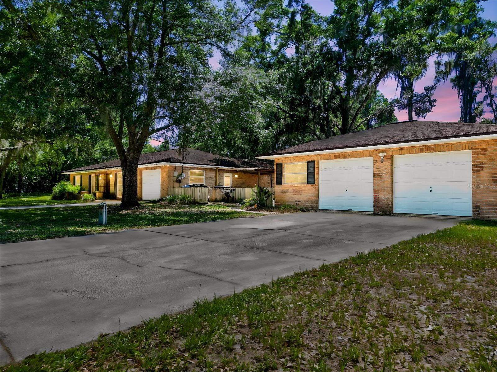 One or more photo(s) has been virtually staged. Located on a quiet dead-end street in the heart of Odessa, this unique property offers endless potential on a spacious .67-acre corner lot shaded by mature trees. Enjoy no HOA and no deed restrictions. Featuring 3 bedrooms, 2 bathrooms, an attached 1-car garage, plus a detached 2-car garage, this home is ideal for buyers looking for extra storage, workshop space, boat parking, or room for hobbies and toys. With two separate driveways and canal access to beautiful Lake Taylor, a 44-acre ski lake, the property is perfectly suited for those seeking the Florida waterfront lifestyle with added flexibility and space. Inside, the home offers great bones and an opportunity to make it your own. Carpets have already been removed in some rooms, providing a head start for renovations and customization. The floor plan offers tons of possibilities, including potential space for a 4th bedroom, home office, or flex room. Whether you're an investor, renovator, or buyer looking to create your dream home, this property presents a rare chance to own canal-front property in desirable Odessa. Roof 2015, AC 2019, Water Heater 1998, NEWER Windows, 2 wells (1 in use). Sold AS-IS for the convenience of the seller. Bring your vision and unlock the potential of this hidden gem with lake access, oversized lot, and incredible opportunity.