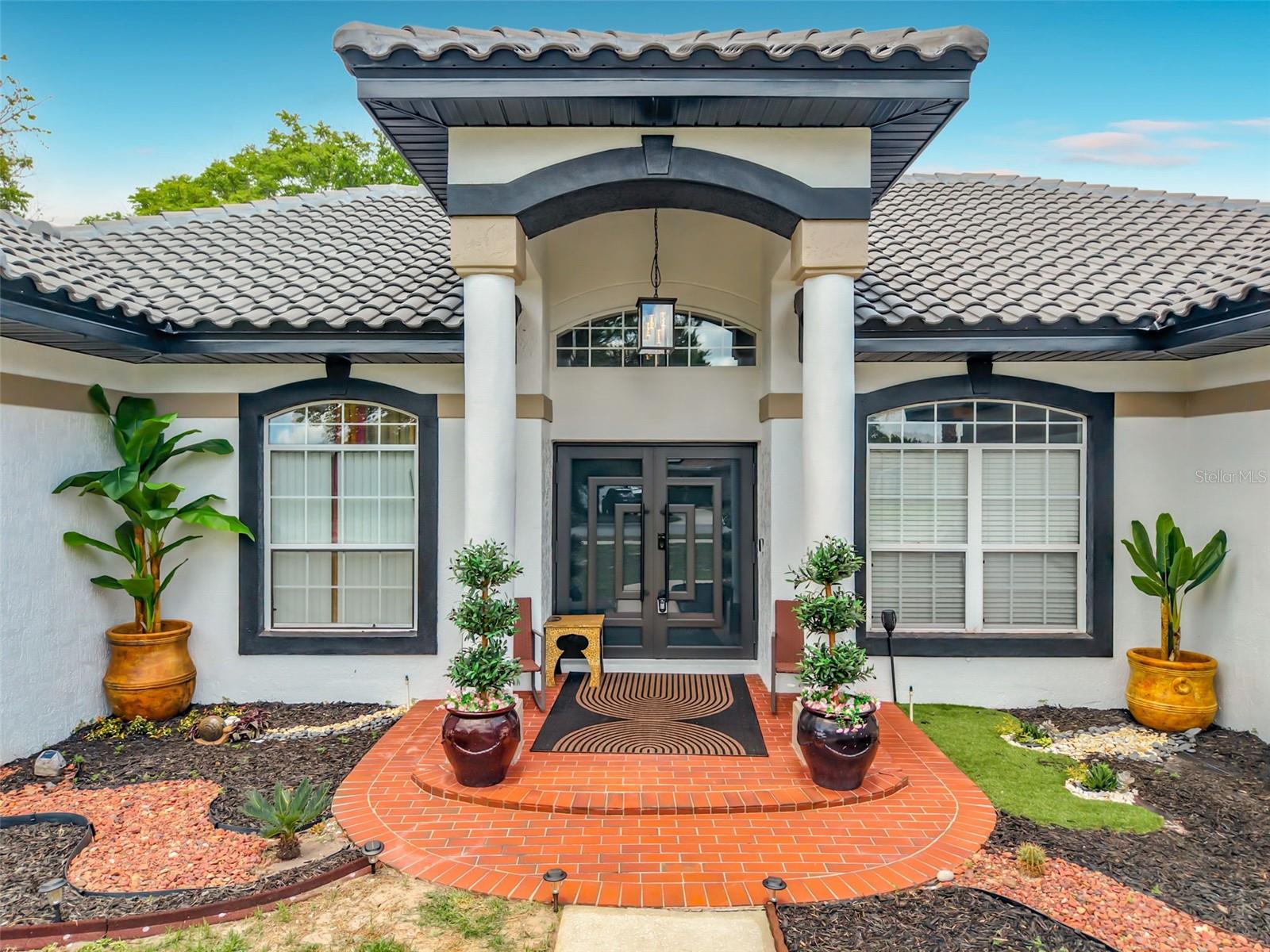 Estate Living at this 4-bedroom, 3-bathroom home offering 3,251 square feet of beautifully updated living space on an expansive .87-acre lot in Deltona.

This home has been thoughtfully renovated from top to bottom. The kitchen is the centerpiece, outfitted with a Thor Kitchen appliance package valued at over $15,000, plus a full appliance package that conveys, including refrigerator, stove, dishwasher, washer, and dryer, for a true turnkey experience. A brand new tile roof and new air conditioning system with an integrated aroma fragrance feature are already in place, so the big-ticket updates are done. Whole-home water purification through Puragain adds another layer of comfort, and the property is connected to public water and sewer, with a private well dedicated solely to irrigation, keeping the .87-acre grounds beautifully maintained year round.

Cozy up to the wood-burning fireplace, with the option to convert to propane, or retreat to the primary suite's oversized walk-in closet, a space that feels more boutique than bedroom. Fresh paint inside and out, neutral tones, modern fixtures, and generous room sizes create a true move-in-ready presentation. Select furnishings are available for purchase for buyers who want an effortless transition.

Built in 1996 and well maintained in an established, quiet neighborhood, this home offers a low HOA paid annually and sits close to major commuter routes, shopping, dining, and top-rated schools.

There isn't another home like this one in Deltona. Space, updates, and move-in-ready luxury, all in one address, priced to sell.

Schedule your private showing today.