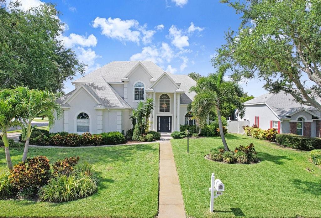 Discover refined Florida living in this stunning, renovated 4-bedroom, 4.5-bath pool home. Offering 3,465 square feet of elegant living space on a spacious 0.28-acre corner lot, this meticulously maintained residence blends luxury finishes with thoughtful design, perfect for both everyday comfort and memorable entertaining.
The beautifully landscaped grounds showcase a rich variety of Florida-native plants and trees, creating a welcoming curb appeal. Inside, recent updates include: fully updated kitchen and baths, granite countertops, striking 24-inch porcelain tile throughout the first level, recently resurfaced heated pool and spa, new electric hot water heater, in-house vacuum system, newer A/C system and carpeting on the staircase and second floor.
The thoughtfully designed floor plan is filled with natural light and features formal living and dining rooms, a generous family room, dinette and a show-stopping gourmet kitchen complete with premium finishes, modern appliances and a large walk-in pantry. A large indoor laundry room adds daily convenience, while a private office with its own separate exterior entrance provides a quiet, flexible workspace.
The luxurious primary suite is a true retreat, highlighted by a spa-like, recently remodeled bath. The additional bedrooms deliver versatility for family, guests, or a home gym. Outside, the resort-style backyard oasis revolves around the beautifully resurfaced heated pool and spa, complemented by a covered lanai and a convenient air-conditioned pool bath which is perfect for year-round relaxation and entertaining.
Additional touches include a fenced in yard, irrigation system, attractive stucco exterior and a large screened lanai that seamlessly connects indoor and outdoor living.
Located in a desirable Bradenton neighborhood with easy access to shopping, dining, top-rated schools, and beaches, this turnkey residence is move-in ready and perfectly positioned for the Florida lifestyle.