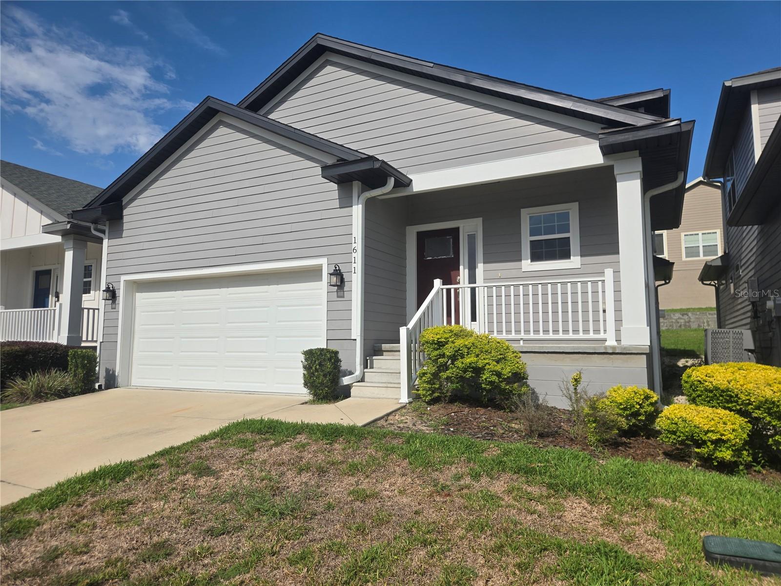 Nearly new, this gently lived in 2021, roomy 3 bedroom, 2.5 bathroom home in the pool community of South Pointe is just minutes to the inviting shops and restaurants in the Town of Tioga. Publix is close in one direction and a brand new Aldi's is almost in walking distance in the other direction. Easy access to I-75, the Oaks Mall and North Florida Regional Hospital. Convenient and worry free living with the HOA maintaining the roof, the home's siding and the lawn maintenance. Take a dip in the community's sparkling pool with plenty of parking, covered seating, restrooms and plenty of poolside seating. Inside enjoy the primary bedroom and bathroom downstairs, an extra roomy, fully equipped kitchen with a practically new dishwasher, pantry, indoor laundry room including the washer, dryer, laundry sink, extra cabinets and even a window! Upstairs are 2 more bedrooms, another full bathroom and a bonus area perfect for a computer workstation or curling up on a comfy couch with a good book. Out front the yard is equipped with a 2 zone irrigation system and there's a covered front porch. A screened porch is available out back from the living room.