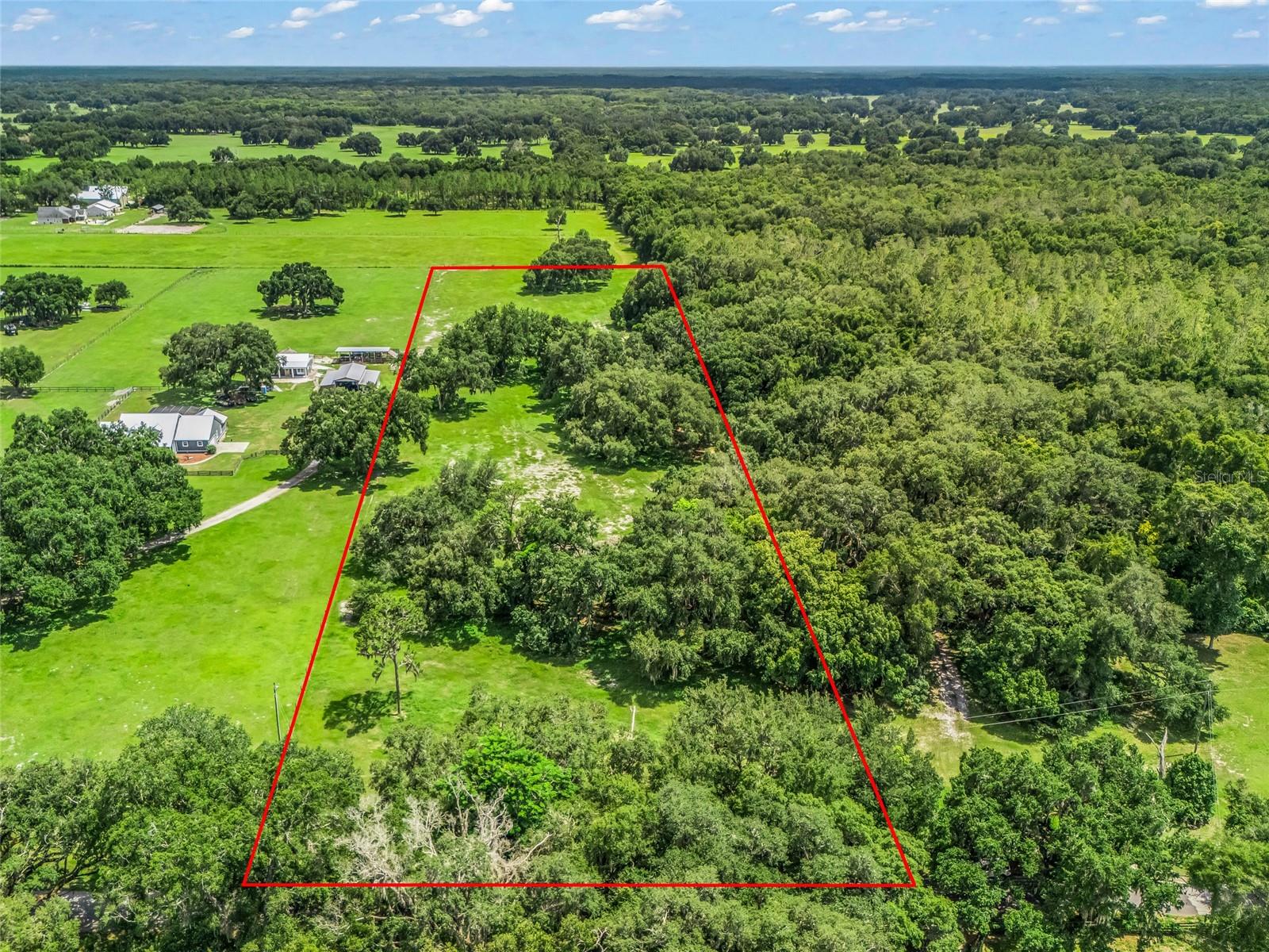 Beautiful 10-acre fenced parcel featuring majestic oak trees and the perfect blend of privacy and convenience. Whether you’re ready to build your dream home, create a private country retreat, or establish your own mini farm, this property offers endless possibilities. Bring your horses and enjoy the peaceful setting with plenty of room to roam.Conveniently located just minutes from I-75, providing easy access to Tampa, Orlando, and Ocala. Everyday necessities, including shopping, restaurants, grocery stores, medical facilities, and other conveniences, are just a short drive away in Bushnell, The Villages, and surrounding communities.If you’ve been searching for acreage with beautiful trees, open space, and a convenient location, this is the perfect place to make your vision a reality