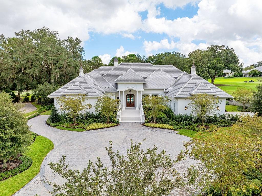 Nestled within the prestigious Golden Ocala Golf & Equestrian Club, the Belle Chateau is the epitome of luxury living. This stunning residence combines elegance with comfort, featuring meticulously designed interiors and breathtaking outdoor spaces. As you enter, you're greeted by a grand foyer that leads to an expansive open-concept living area, bathed in natural light. High ceilings and exquisite crown molding create an inviting atmosphere, while the gourmet kitchen, equipped with top-of-the-line appliances and a spacious island, is a chef’s dream. The Belle Chateau boasts multiple luxurious bedrooms, each with en-suite bathrooms and custom walk-in closets. The master suite is a true retreat, featuring a spa-like bathroom with a soaking tub and a rainfall shower, providing a serene escape. Step outside to your private oasis, where an elegantly designed pool and spa await. Lush landscaping and serene views of the surrounding golf course enhance the tranquility of this exquisite property. Perfect for entertaining or relaxing, this outdoor space seamlessly blends luxury with nature. Located in the heart of the Golden Ocala Golf & Equestrian Club, residents enjoy exclusive access to world-class amenities, including a championship golf course, equestrian facilities, and a vibrant community atmosphere. Experience unparalleled luxury in the Belle Chateau, where sophistication meets the equestrian lifestyle. Your dream home awaits.