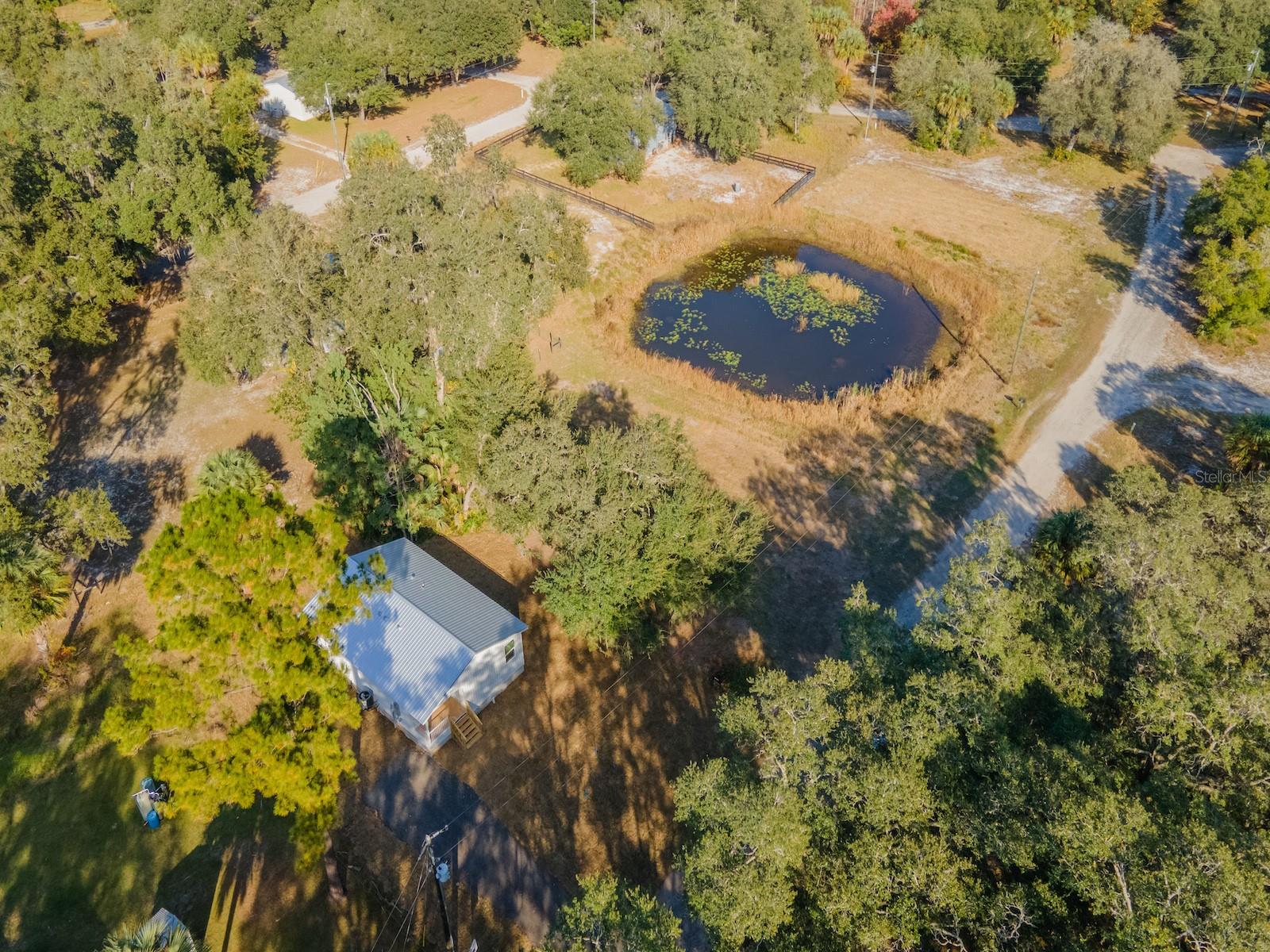 Modern New Construction with Premium Finishes

11629 NE 145 Place, Fort McCoy, FL 32134
3 Bedrooms | 2 Bathrooms | 936 Sq Ft | Built 2025 | .21 Acre

Why settle for an older home when you can own brand-new? This newly completed 2025 home delivers the perfect combination of modern design, quality craftsmanship, and low-maintenance living in a convenient Fort McCoy location.

From the moment you pull into the driveway, you'll appreciate the clean curb appeal featuring bright exterior finishes, a durable metal roof, fresh landscaping, and a welcoming covered front porch. Designed for efficiency and comfort, this thoughtfully crafted home makes excellent use of every square foot.

Inside, the open-concept living area feels bright and spacious thanks to soaring cathedral ceilings, recessed lighting, and luxury vinyl plank flooring that flows seamlessly throughout the entire home. The heart of the home is the beautifully designed kitchen featuring granite countertops, solid wood cabinetry with soft-close doors and drawers, a pantry for extra storage, and a full suite of stainless-steel appliances.

The private primary suite offers a comfortable retreat complete with a spacious closet and a beautifully finished bathroom featuring a custom tiled shower with glass enclosure, granite vanity top, and quality fixtures. Two additional bedrooms provide flexibility for guests, family members, or a home office. The guest bathroom showcases a steel tub with tiled surround, granite vanity top, and matching premium finishes.

Additional features include energy-efficient construction, modern materials, dedicated laundry space for a stackable washer and dryer, and plenty of yard space for outdoor enjoyment, gardening, or future improvements.

Located just minutes from downtown Fort McCoy, you'll enjoy convenient access to grocery shopping, dining, healthcare, hardware stores, and everyday necessities. Outdoor enthusiasts will love being close to the Ocklawaha River, Ocala National Forest, Salt Springs, Silver Glen Springs, and Juniper Springs, offering endless opportunities for boating, fishing, hiking, hunting, and trail riding.

Whether you're looking for your first home, a seasonal retreat, or an investment in a growing area, this move-in-ready new construction home offers exceptional value and modern living in the heart of North Central Florida.

Schedule your private showing today and be the first to call this beautiful home your own.