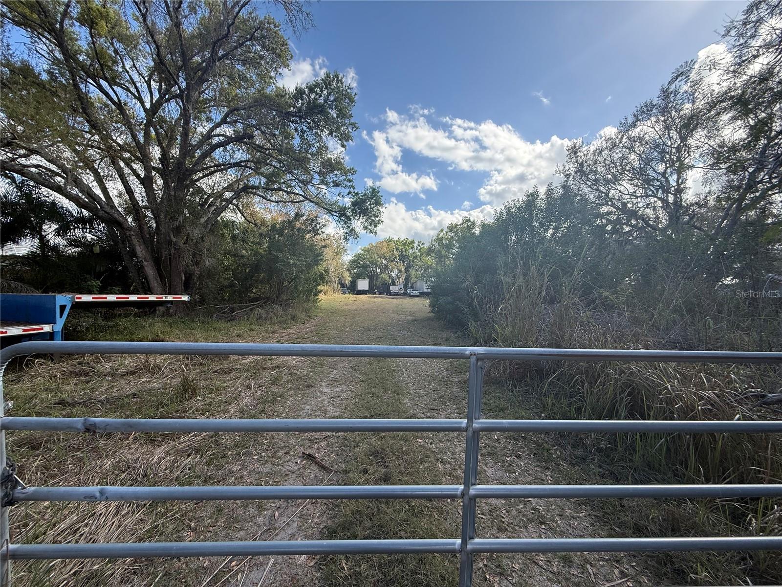 Prime 1 acre opportunity in one of Parrish’s fastest-growing and most talked-about corridors. Located on the east end of Moccasin Wallow Road, just moments from the US 301 roundabout, this property sits directly in the path of explosive commercial and residential expansion that is actively reshaping the area.

This is not just another vacant parcel; it’s a strategic position in a rapidly developing corridor where momentum is already well underway. Directly across the road and surrounding the immediate area, you’ll find major ongoing development, including a new hospital and significant commercial projects that are driving traffic, infrastructure improvements, and long-term value. Large developers have already secured much of the surrounding land, making remaining opportunities like this increasingly rare.

Positioned with direct frontage along Moccasin Wallow Road, this property benefits from strong visibility, accessibility, and proximity to key growth nodes. As the area continues to evolve, parcels in this location are becoming harder to acquire, especially those offering a full acre of usable land.

Currently zoned as a vacant residential parcel, this property presents a blank canvas for a buyer with vision. Whether you are looking to hold for appreciation, invest in a high growth corridor, or explore the potential for future rezoning or alternative use, the upside here is significant. Buyers should conduct their own due diligence and verify all zoning, land use, and development possibilities directly with Manatee County.

The property includes an existing well on site (no power currently connected), offering a starting point for future utility needs. In addition, commercial utilities are available at the road frontage along Moccasin Wallow, further enhancing the long-term development potential and flexibility of this parcel.

What truly sets this property apart is timing. Growth is no longer speculative in this area, it is happening now. Infrastructure is being expanded, major employers and medical facilities are moving in, and surrounding land is being absorbed quickly. Opportunities to secure land in this corridor before full build-out are becoming limited.

If you’ve been watching Parrish and waiting for the right opportunity to position yourself ahead of continued growth, this is your chance. Whether for investment, future development, or land banking, this property offers location, visibility, and momentum that are difficult to replicate.

Opportunities like this do not come around often, especially in a corridor that is already proving itself. Secure your position now and take advantage of the growth that is already in motion.