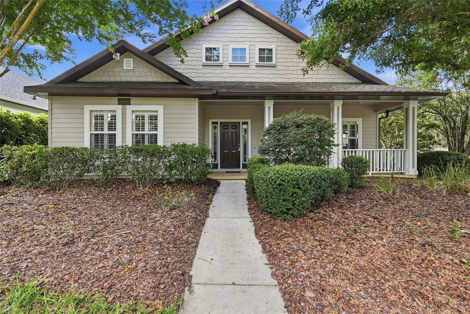 Beautiful oversized three bedroom split plan in the coveted neighborhood of Longleaf! Designed with a spacious open floor plan, this home offers seamless flow between the living, dining, and kitchen areas. As you enter, the den is centered around a wood burning fireplace. The open-concept kitchen overlooks the main living area, making it easy to stay connected with family and guests while preparing meals.  The kitchen features matching white appliances and a massive breakfast bar. The appliances include a side by side refregerator, electric range, microwave and dishwasher. The owner's suite has a large walk-in closet, a garden tub, double vanity, and a tiled shower. There is a large laundry room with a full size washer and dryer and a spacious 2 car garage with electronic opener. Enjoy the afternoon on the private screened in porch or cool off at the nearby, community pool. The resort style amenity center also features a playground, basketball court and tennis courts! Just minutes away from some of the best shopping and restaurants off of Archer Road and 12 minutes to UF. Schedule your showing today!