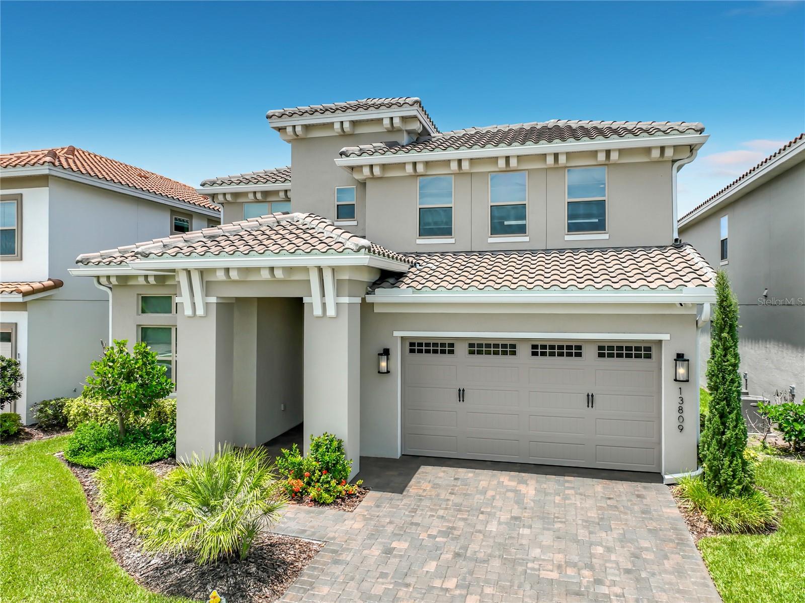 Virtually Staged. Welcome to luxury waterfront living in the highly sought-after gated golf community of Eagle Creek in the heart of Lake Nona. This stunning 5-bedroom, 4-bath residence offers over 3,200 square feet of thoughtfully designed living space with panoramic pond and fountain views, high-end upgrades, and an exceptional open-concept floor plan perfect for everyday living and entertaining.

The designer kitchen is truly the centerpiece of the home, showcasing an oversized quartz island, 42-inch cabinetry with stacked upper cabinets, stainless steel appliances, a new farmhouse apron-front sink, walk-in pantry, abundant storage, and contemporary finishes throughout. The spacious living and dining areas flow seamlessly to the covered lanai through expansive sliding glass doors, creating an incredible indoor-outdoor lifestyle with beautiful water views.

The first-floor owner's suite offers a peaceful retreat with picturesque pond views, an oversized walk-in closet with custom shelving, and a luxurious spa-inspired bath featuring dual vanities, extensive cabinet storage, and a massive walk-in shower with dual rainfall shower heads. The owner's closet conveniently connects directly to the laundry room. A guest bedroom, full bath, and mudroom complete the first floor.

Upstairs features a private second ensuite bedroom with its own walk-in closet and bath, two additional bedrooms connected by a shared bath, and a spacious loft that is ideal as a media room, game room, home office, or second family room, including 65in LGTV with sound-bar.  Step onto the covered balcony and enjoy tranquil views overlooking the pond and illuminated fountain.

The covered rear lanai is already pre-plumbed and pre-wired for the outdoor kitchen you've always wanted. The two garage also includes a professionally finished, climate-controlled 11' x 11' flex room connected to the home's central HVAC and enhanced with its own dedicated portable A/C system, making it ideal for a workshop, fitness room, hobby room, or private office.

Professionally upgraded in 2026, this home features new LG Smart kitchen and laundry appliances, a whole-home hardwired Sonos audio system with multiple listening zones, under-cabinet lighting, all 5 bedrooms and bonus room have 4 can recessed LED lights with Lutron dimmers throughout, Hunter ceiling fans in every bedroom, 3 Ring security cameras, updated designer lighting, and a French drain. Select furnishings, mounted televisions, and premium electronics are also included, making this an outstanding turnkey opportunity.

Residents enjoy Eagle Creek's resort-style amenities, including championship golf, clubhouse, multiple pools, fitness center, tennis and basketball courts, playgrounds, dog park, and scenic walking trails. Conveniently located just minutes from Lake Nona Medical City, Orlando International Airport, SR-417, SR-528, premier shopping, dining, and top A-rated schools—including an elementary school within the community.

Luxury finishes, breathtaking waterfront views, extensive upgrades, and one of Lake Nona's most desirable gated golf communities make this an exceptional place to call home. Schedule your private showing today!