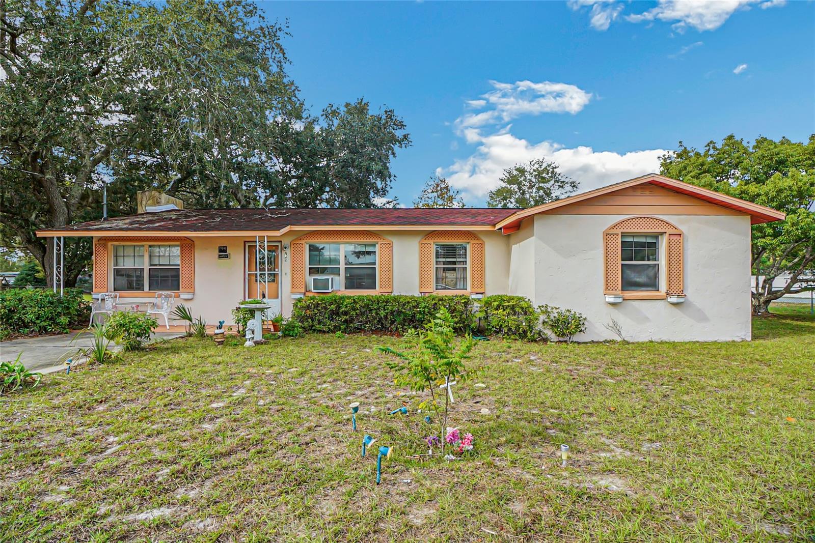 Priced To Sell 3 Bed, 1 1/2 Bath, Block Home Needs TLC to Make it Your Own.  Roof redone in 2016, Hot Water Heater replaced in 2023. Home needs a new HVAC System which we have a quote of $7000.00 for replacement from Tropic Air. Containing 1314 square feet, this home features a wood burning fireplace, indoor laundry room with washer and dryer, window units and a large 18X18 screened in lanai. The .38 acre yard is completely fenced and it contains a detached 2 car garage which has electric and plumbing.  Located within just minutes to The Villages, shopping, restaurants, doctors and more!  Don't hesitate to call or this home listed Under $200,000 will be gone!