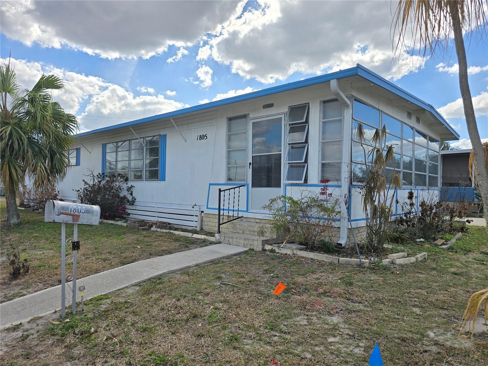 PRICED BELOW APPRAISED VALUE ~Classic mobile retreat, ready for a refresh!~
Appraised as is at $86,000 with land included and low HOA fees at only $400 per year, this classic mobile retreat is ready for a refresh! This 2 bedroom/2 bath home is situated on a corner lot in the coveted and gated 55+ Skyview Estates Community. Features include a neutral color scheme throughout, spacious rooms, inside utility closet, updated kitchen with granite countertops, solid wood cabinetry, and stainless steel/black appliances, generous 12x21 enclosed sunroom/patio with ceramic tile flooring and an abundance of natural light, plus a separate storage room/workshop. This property offers excellent potential and is being sold as is. Certain repairs are needed, and affordable repair estimates are available upon request. All measurements are approximate, and buyers and buyer’s agents are encouraged to verify all information independently.