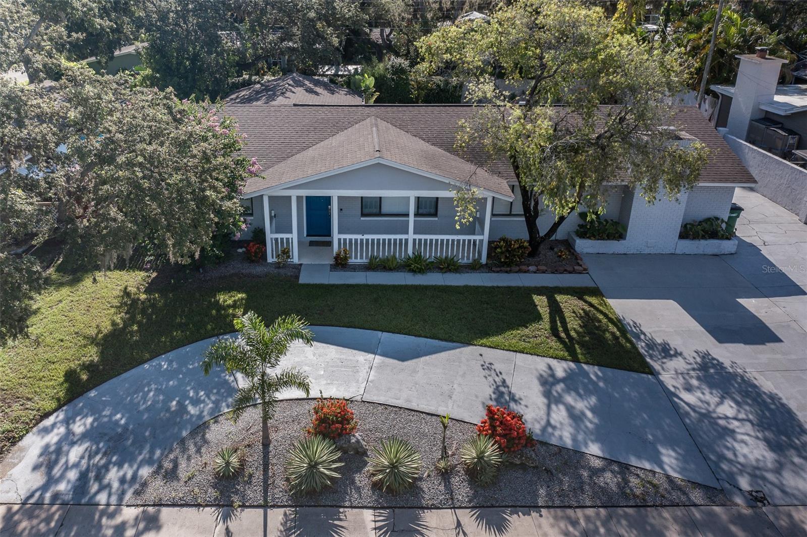 This gorgeous pool home is truly captivating! Fully updated, it offers 5 bedrooms and 3 bathrooms, including two master suites on opposite sides of the house, each with private en-suites. The split-bedroom layout provides ample space for family or guests. The front door opens to a spacious Great Room that encompasses the living, dining, and kitchen areas. The updated kitchen features stainless steel appliances, granite countertops, and a charming coffee nook. Sliding glass doors lead to the pool deck, ideal for relaxing by the water. The fully fenced backyard includes a storage shed for extra convenience. Both master bedrooms have direct access to the pool deck and yard. The sparkling pool is oversized and always inviting. Currently listed on Airbnb, this property generates impressive returns. A circular driveway provides plenty of parking, and nearby Downtown Safety Harbor offers shopping, spas, restaurants, and breweries. Whether you keep it as a rental or make it your own, this Tampa Bay gem is a must-see. Philippe Park and Tampa Bay are just steps away with beautiful grounds and a boat launch, and flood insurance is NOT required. Don’t miss out—schedule a showing today!