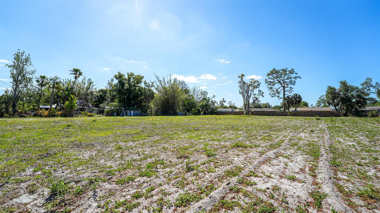 An exceptional and rarely available opportunity to secure a full-acre homesite in one of Sarasota area's most coveted, non-deed-restricted, completely free of HOA fees, covenants, or limitations. This premier parcel delivers the kind of creative freedom and development flexibility that discerning buyers and savvy investors seek.
With approved potential to subdivide into up to four individual parcels, the site is ideally suited for a single grand private estate, a bespoke multi-generational compound, or a boutique luxury development of up to four custom residences. The choice is yours.

Build one iconic home on the entire acre or maximize the land's value by creating multiple premium homesites.
Positioned directly across from the forthcoming Phillippi Creek Park, future residents will enjoy seamless, on-demand access to the water, launching kayaks, paddleboards, and other watercraft steps from home. This coveted proximity delivers all the lifestyle benefits of waterfront living without the premium price tag, maintenance demands, or flood zone restrictions typically associated with direct waterfront properties.

Whether you envision a legacy estate, a thoughtfully designed multi-generational retreat, or a high-end investment development, this one-of-a-kind parcel represents a rare convergence of location, flexibility, and lifestyle, an opportunity not to be overlooked.