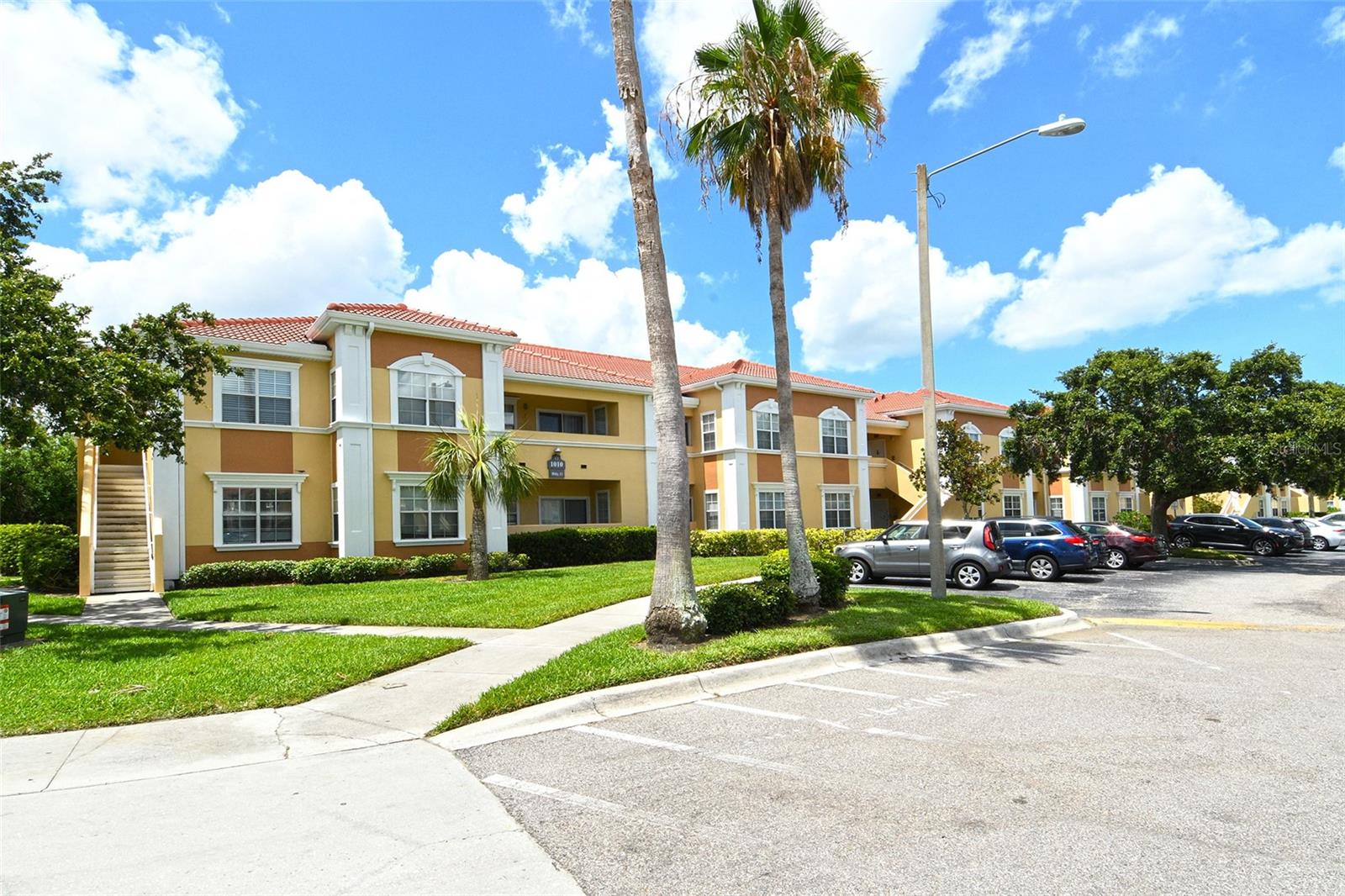 You can move in immediately or rent right away for everything you could need is included - furniture, decor, window treatments, kitchen service items, sheets, towels, porch furniture and pillows, all appliances.  This is truly turnkey!  Three bedroom units are coveted and particularly when they include a deeded carport for parking. The has been beautifully remodeled with granite countertops, luxury linoleum throughout, and all furniture and decor to match the Florida coastal lifestyle.  The buildings are only two stories high and this condo is on the second floor eliminating any issues of pedestrian or car traffic directly in front of your windows or any potential rising water. 
Villagio has remained a community in high demand due to its proximity to downtown Sarasota, the spring training stadium for the Baltimore Orioles, sporting parks, independent restaurants and stores, grocery, schools, and public transportation.  Villagio is a gated community with a pool, fitness room, clubhouse, pool, tennis and pickleball courts, a small putting green, designated dog area, and green space with picnic tables.  It remains a wonderful place to live full-time, seasonally, or as a rental investment (one month minimum, maximum 3 times per year).  Pet and all age-friendly.