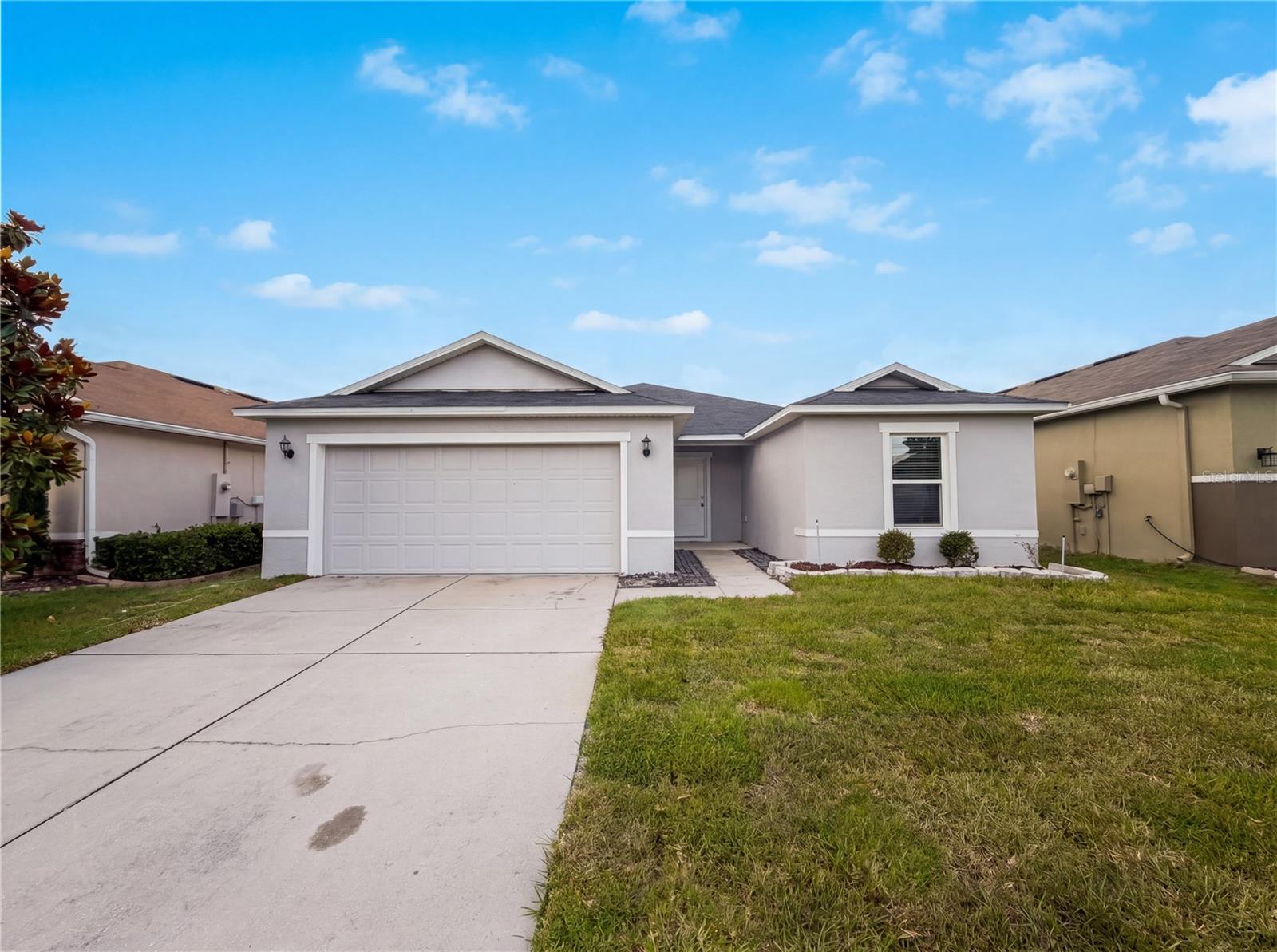 One or more photo(s) has been virtually staged. Explore 4272 Moon Shadow Loop, recently updated with fresh interior paint and partial flooring replacement throughout. The kitchen includes a functional island and all stainless steel appliances, enhancing everyday utility. The primary bathroom provides double sinks for added convenience. Outside, a covered patio extends to a fully fenced backyard, providing dedicated exterior space. This updated residence with functional comforts is ready for move-in.. Included 100-Day Home Warranty with buyer activation