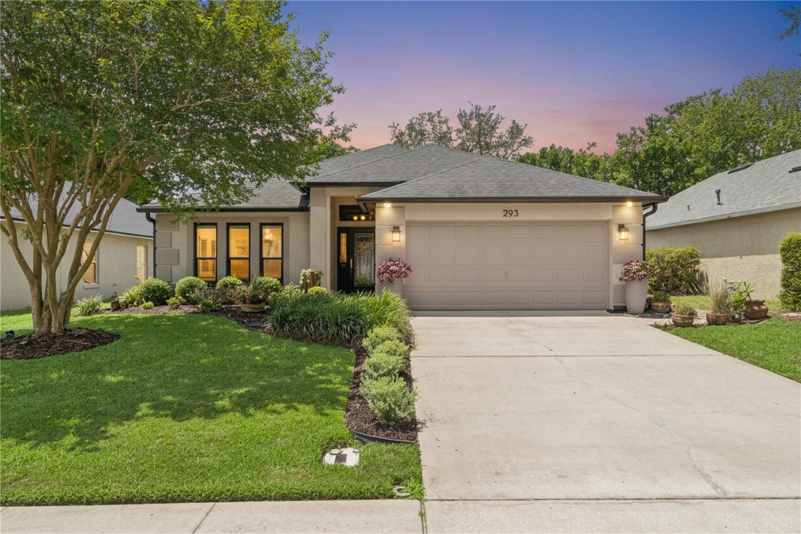 Gorgeous 3-bedroom, 2-bath home in desirable Saxon Ridge! This beautifully maintained property sits on a large, fully fenced lot with mature landscaping and numerous recent upgrades. Features include upgraded windows that are all hurricane impact rated including the sun tunnel with the exception of the front door, sidelight and transom which is hurricane impact protected by the hurricane roll down shutter. Upgraded whole-house air filtration system, living room surround sound, and premium finishes throughout. The kitchen offers granite countertops, a sun tunnel, and upgraded appliances. The remodeled primary bath has been FULLY updated with a spa like shower, quartz vanity countertop, while the guest bath features granite. Flooring includes wood laminate in the primary bedroom and wood laminate in the family room, complemented by neutral tones throughout. 
Additional improvements include upgraded landscaping, garage floor coating, pavers from front to back, leaded glass front door, upgraded hardware, storage shed, and robotic mower. Major updates: roof (2019), dishwasher (2021), water heater (2022), refrigerator (2022), A/C (2023), microwave (2025), air purifier (2025), and hurricane impact windows (2025). Natural gas available!
Relax on the screened and shaded back porch overlooking a fully fenced yard with fruit trees and an 8x8 shed. The community sports complex is just a short walk away and includes a pool, basketball court, volleyball court, soccer field and clubhouse. Conveniently located near shopping, dining, and I-4 for an easy commute.