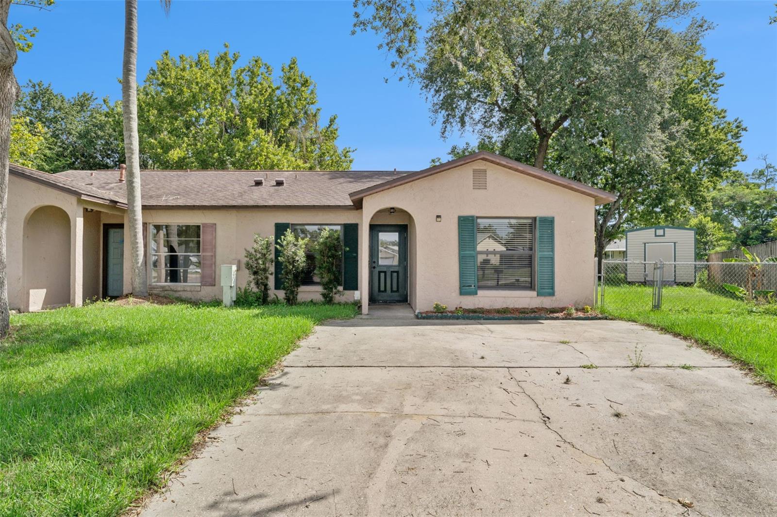 Updated 2BR/2BA Home in Quiet Cul-de-Sac Near the Beach. Move-in ready with tile flooring throughout, hurricane impact windows and doors installed in 2022, updated HVAC installed in 2022, and new LED light fixtures with dimmer switches. Ceiling fans in key rooms add comfort year-round. Enjoy a covered patio and fully fenced yard offering privacy with no rear neighbors, backing to a peaceful creek and natural wildlife views. Ample storage space plus a detached shed provides extra convenience. Located in an established Titusville neighborhood just minutes from beaches, shopping, and major roadways. A rare blend of updates, storage, and serene Florida living.