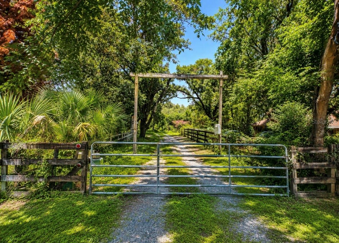 Rare 4.58-Acre Waterfront Parcel in the Heart of Longwood! This exceptional property presents a unique opportunity to build your dream estate or explore future development potential in one of Seminole County's most desirable locations. Nestled among established estate homes, the property features approximately 425 feet of pond frontage, mature trees, and a picturesque setting that offers the perfect blend of privacy, natural beauty, and everyday convenience.

With more than 4.5 acres, there's plenty of room to create a custom residence with a detached garage, workshop, guest house, resort-style pool, recreational amenities, and more. The previous home has been removed, creating a blank canvas ready for your vision. An existing well and septic system are already in place, adding value and reducing future development costs.

Enjoy the tranquility of country-style living while being just minutes from shopping, dining, major highways, top-rated Seminole County schools, and the many attractions of Central Florida.

Large acreage parcels in Longwood are increasingly difficult to find. Whether you're seeking a private waterfront retreat or a property with investment and development potential, this is an opportunity you won't want to miss. Buyers are encouraged to verify zoning, land use, lot split potential, utility availability, and development requirements with Seminole County.