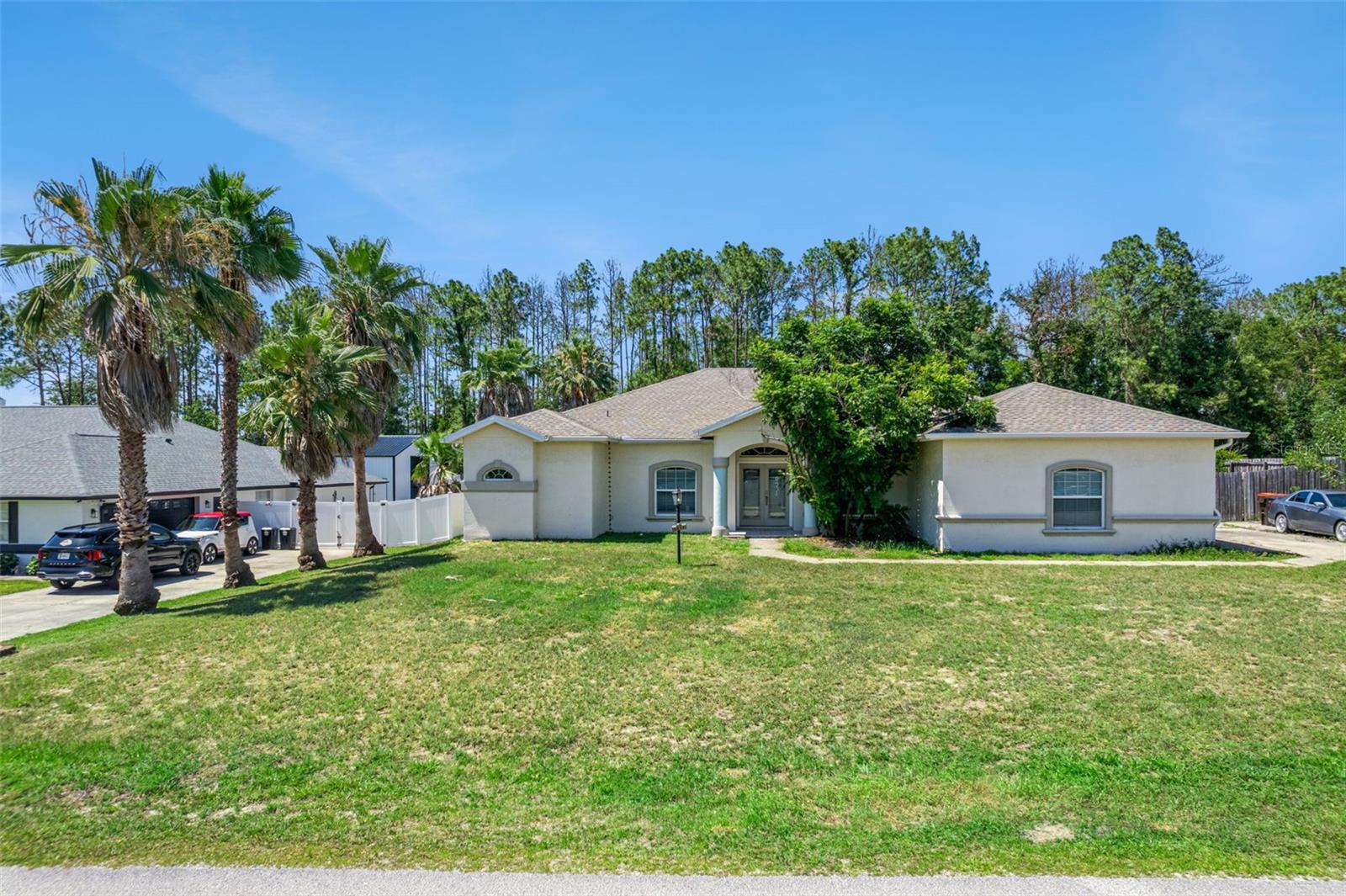 Welcome to this beautifully renovated 5-bedroom, 3-bathroom home situated on a spacious half-acre lot in Ocala. Fully updated in 2019, this move-in ready property offers the perfect blend of modern style and functional living. Step inside to an expansive open-concept floor plan featuring tile flooring throughout and a stunning chef’s kitchen complete with quartz countertops and an impressive 12-foot island that serves as the heart of the home. The luxurious primary suite and additional bathrooms showcase beautifully tiled modern showers, creating a spa-like feel throughout. With all major mechanical systems replaced in 2019, this home offers peace of mind and low-maintenance living for years to come. Enjoy the extra space and privacy of a half-acre lot while being conveniently located near shopping, dining, and all that Ocala has to offer. This is the perfect opportunity to own a fully updated home with room to spread out both inside and out.