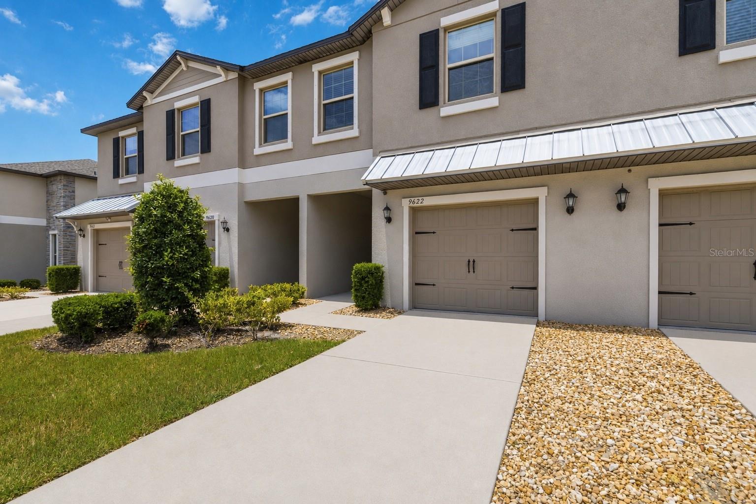 Some townhomes feel like you are living window-to-window with the neighbors. This one feels different.

Built in 2021 in Cypress Creek, this home sits on a premium lot backing to a natural view, giving the back of the home a more open, private feel that is hard to find in townhome living. From the covered patio, you are not staring into another row of homes. You have a calmer backdrop, a little breathing room, and a spot that makes morning coffee, evening grilling, or a slower weekend feel a lot more inviting.

Inside, the main level is designed for real life. The kitchen opens naturally to the living area, so cooking, watching the game, catching up after work, or having people over all happen in one connected space. Neutral finishes, tile flooring downstairs, granite counters, stainless steel appliances, and an easy flow make the home feel comfortable without asking the next owner to take on a project the second they move in.

Upstairs, the layout gives everyone more flexibility. The loft-style space works well as a second hangout area, home office, gaming space, workout corner, or whatever version of “extra room” life currently demands. The owner's suite includes a spacious bedroom, walk-in closet, and dual-sink vanity, while the additional bedrooms offer room for guests, family, or work-from-home needs.

Cypress Creek adds convenience to the lifestyle, with the townhome pool just a couple steps away and additional amenities throughout the broader community. Everyday shopping, grocery options, coffee stops, casual restaurants, takeout, and local services are all close by, making it easy to handle errands, grab dinner, or meet friends without turning every outing into a production.

Newer construction, a practical two-story layout, community amenities, and a nature-view setting that helps this townhome live a little more privately than most.